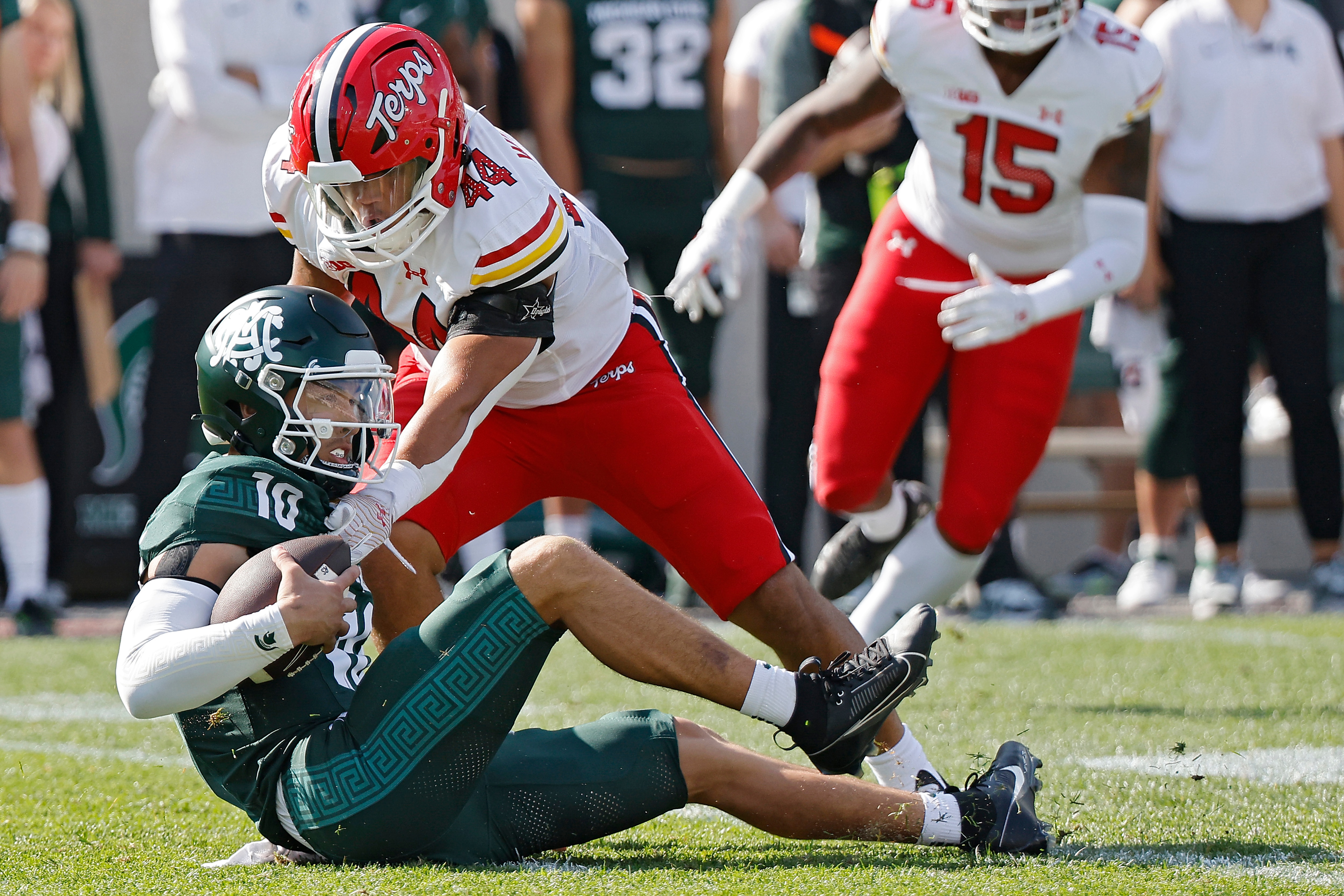 EAST LANSING, MICHIGAN - SEPTEMBER 23: Noah Kim #10 of the Michigan State Spartans is sacked by Caleb Wheatland #44 of the Maryland Terrapins at Spartan Stadium on September 23, 2023 in East Lansing, Michigan. (Photo by Mike Mulholland/Getty Images)