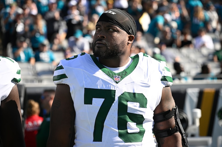 Former New York Jets guard John Simpson looks on from the sideline before a game against the Jacksonville Jaguars in Week 15.