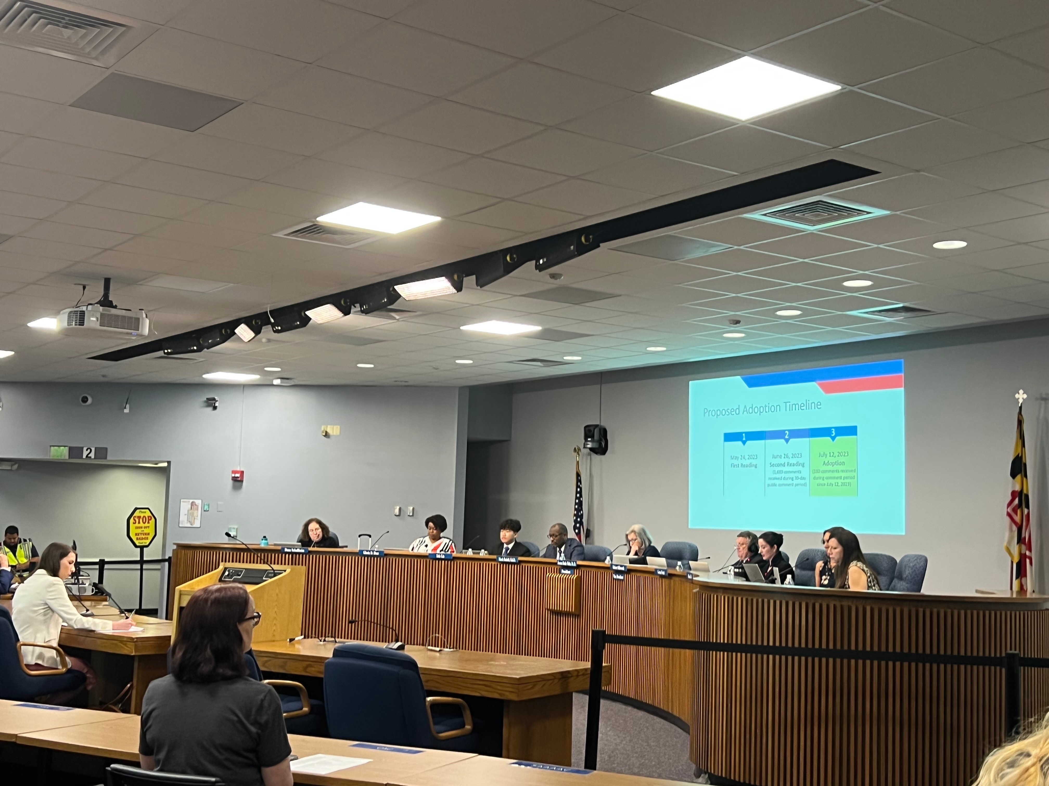 Members of the Anne Arundel County Board of Education debate a policy limiting flags on school property on July 12, 2023.