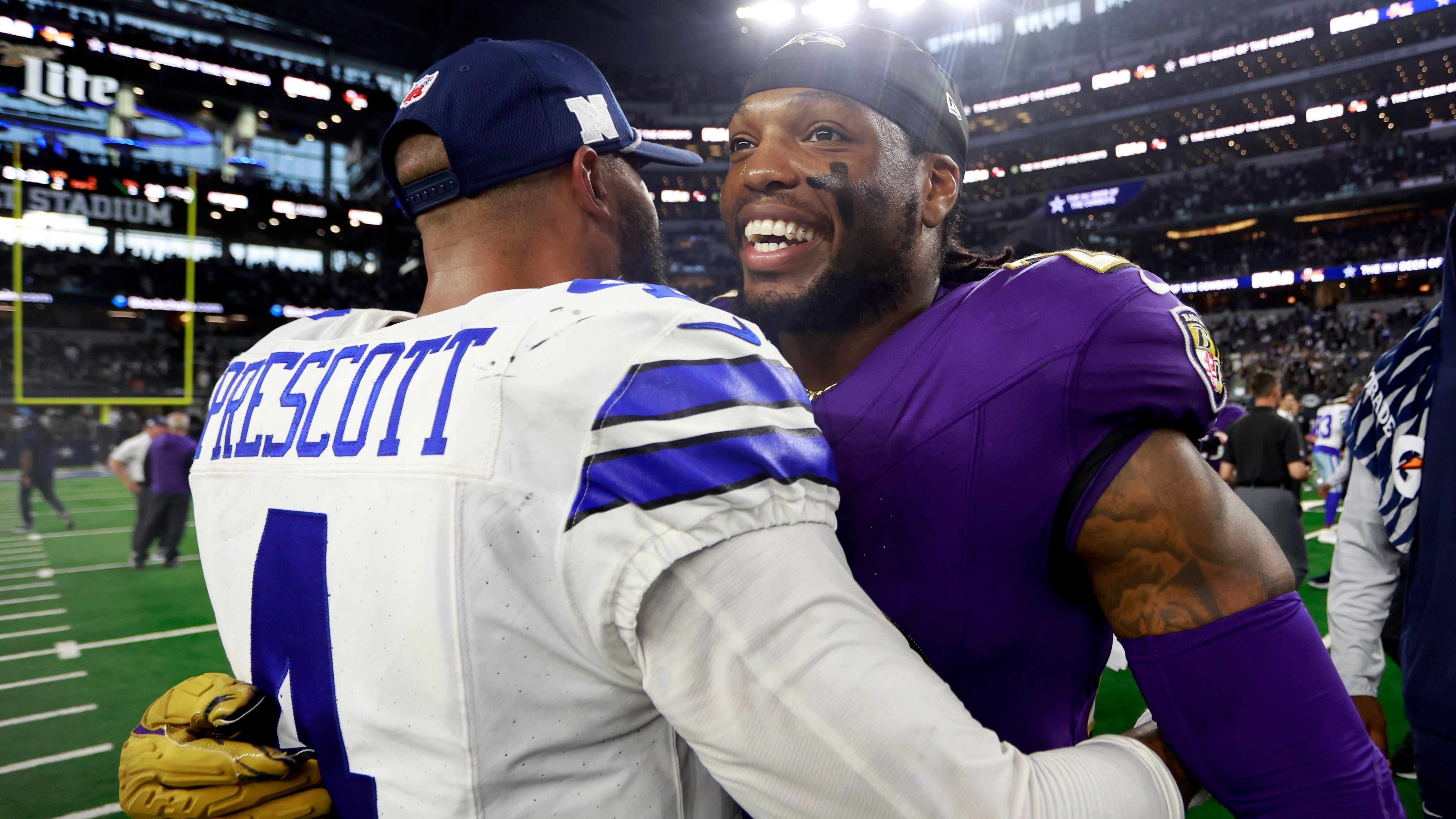 Dallas Cowboys quarterback Dak Prescott (4) and Baltimore Ravens running back Derrick Henry, right, greet each other after their team's NFL football game in Arlington, Texas, Sunday, Sept. 22, 2024. (AP Photo/Gareth Patterson)