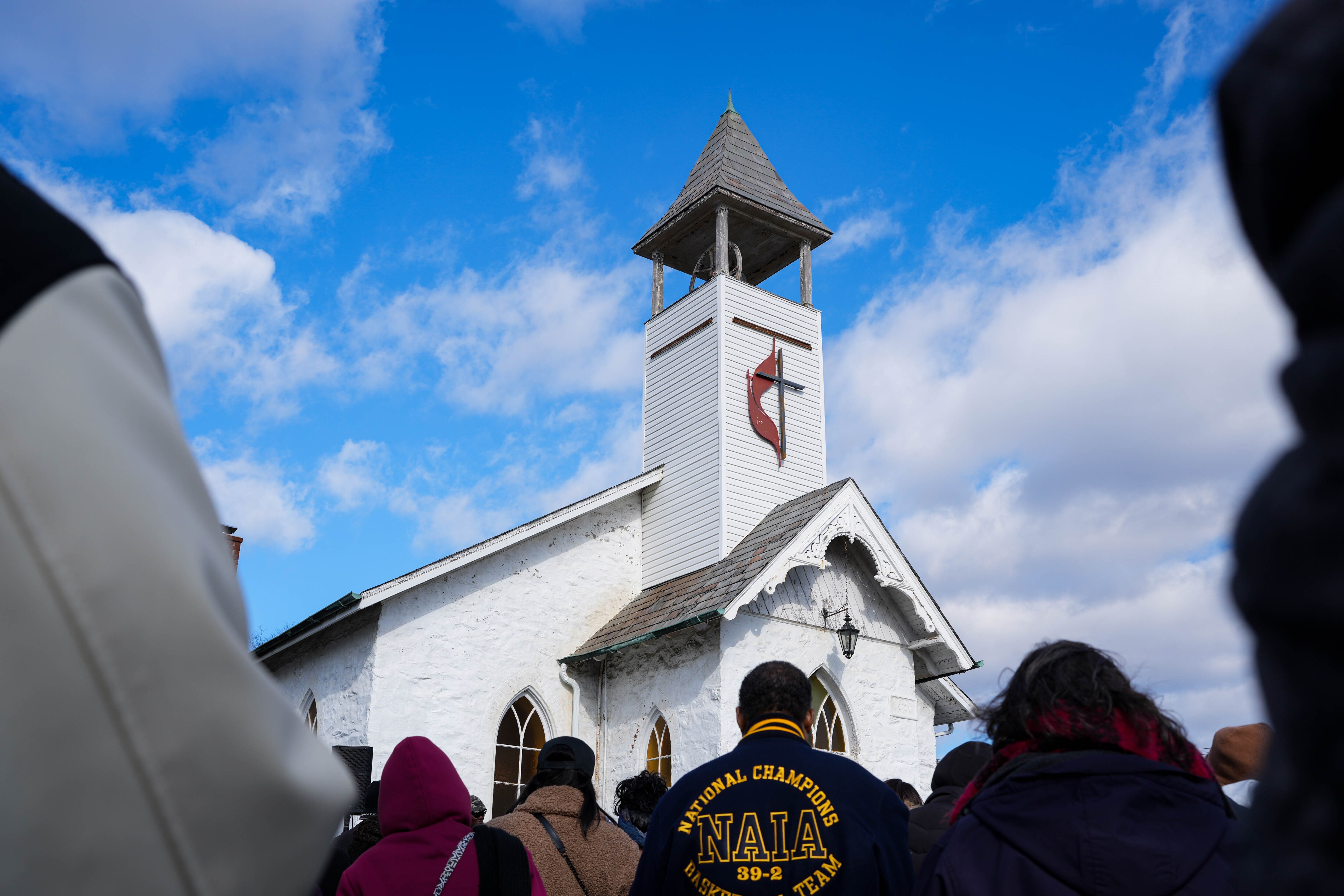 A crowd gathers outside Emmarts United Methodist Church after an Underground Railroad commemorative walk in Windsor Mill on Saturday.