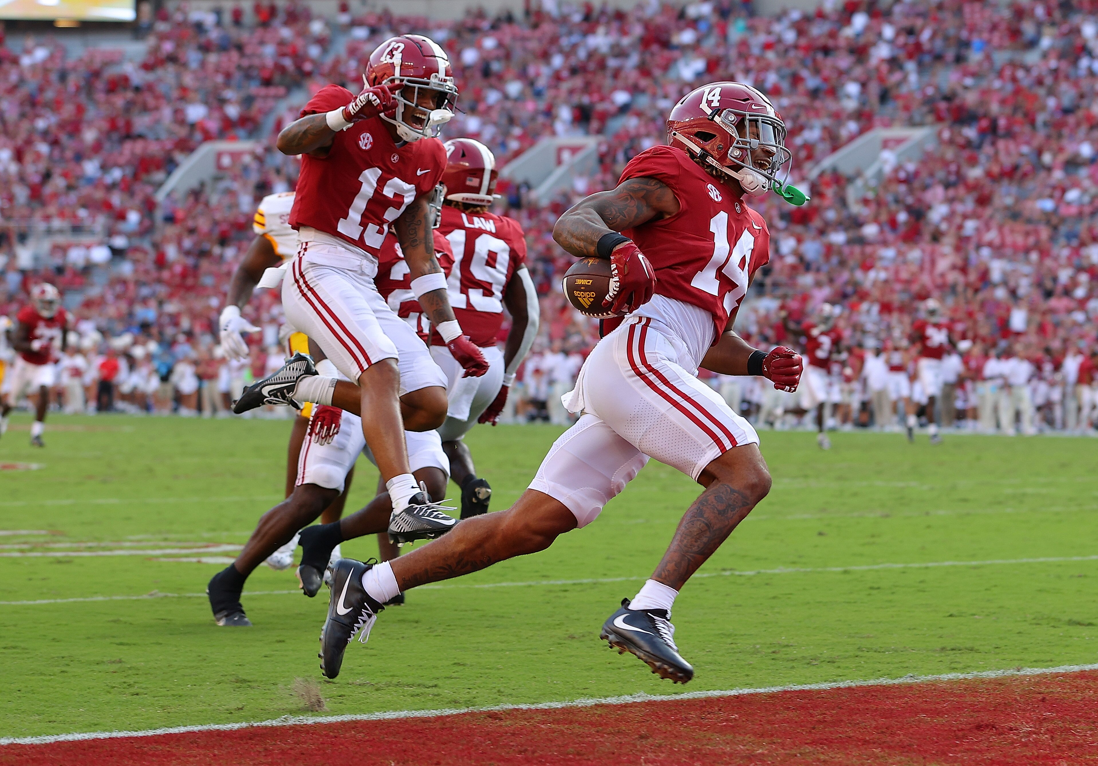 TUSCALOOSA, ALABAMA - SEPTEMBER 17:  Brian Branch #14 of the Alabama Crimson Tide returns this punt for a touchdown against the Louisiana Monroe Warhawks during the fourth quarter at Bryant-Denny Stadium on September 17, 2022 in Tuscaloosa, Alabama.