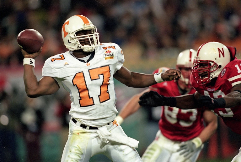 2 Jan 2000: Tee Martin #17 of the Tennessee Volunteers gets ready to pass the ball as Carlos Polk #13 of the Nebraska Cornhuskers comes at him during the Fiesta Bowl Game at the Sun Devil Stadium in Tempe, Florida. The Cornhuskers defeated the Volunteer