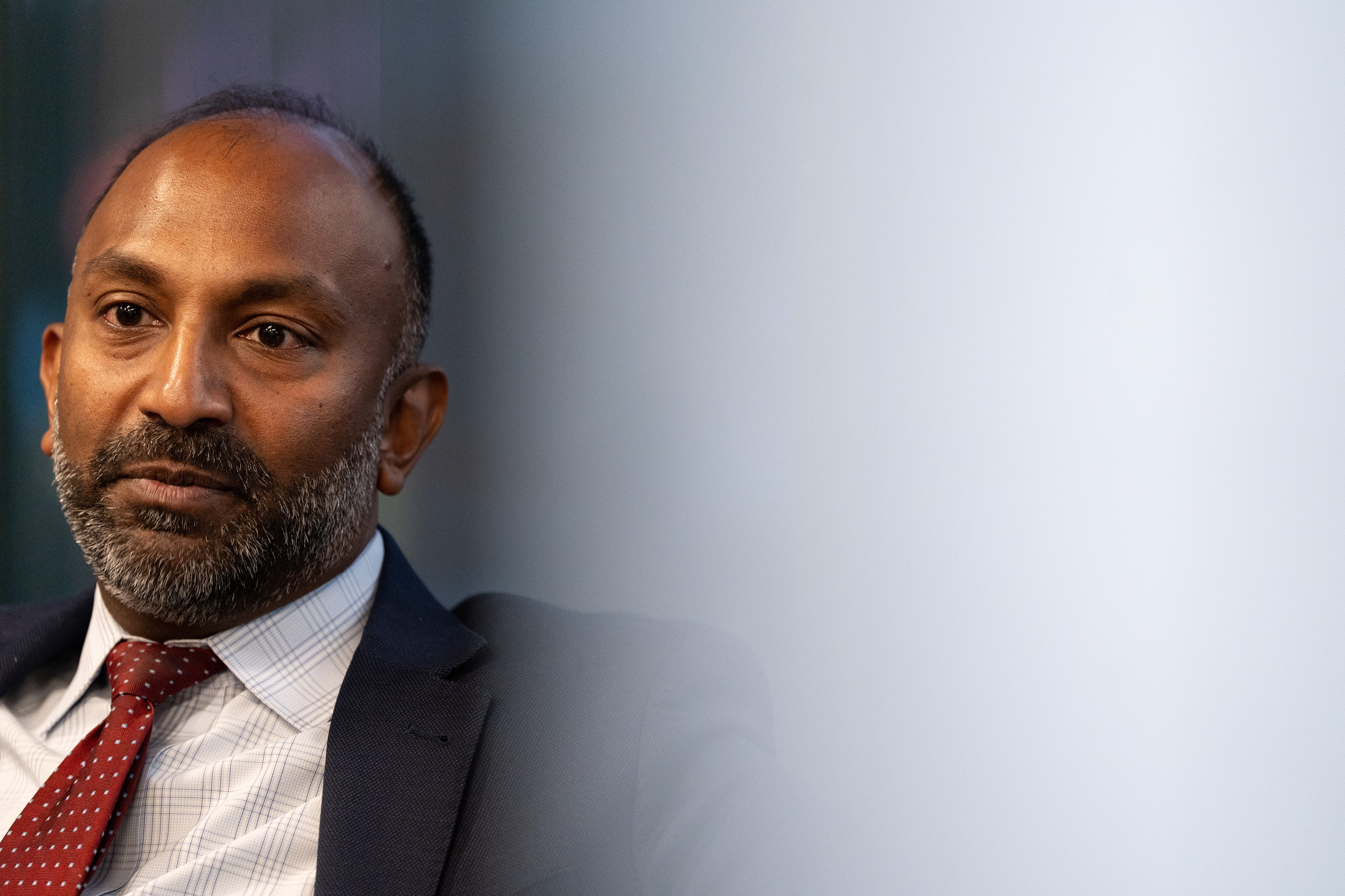 Attorney Thiru Vignarajah sits for an interview about his bid for Baltimore mayor in his office in the Inner Harbor on Tuesday, Jan. 23, 2024.