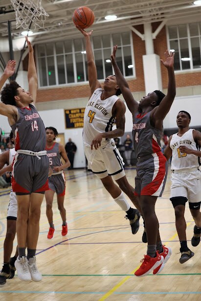 Lake Clifton's Zammari Dorsey puts up a shot as Edmondson's Makhi West (left) and Kyrie Sherrod defends during Friday's Baltimore City boys basketball contest. Dorsey finished with 16 points as the No. 6 Lakers defeated eighth-ranked Edmondson, 50-46, in the rematch of last season's Class 1A state and Baltimore City championship games.