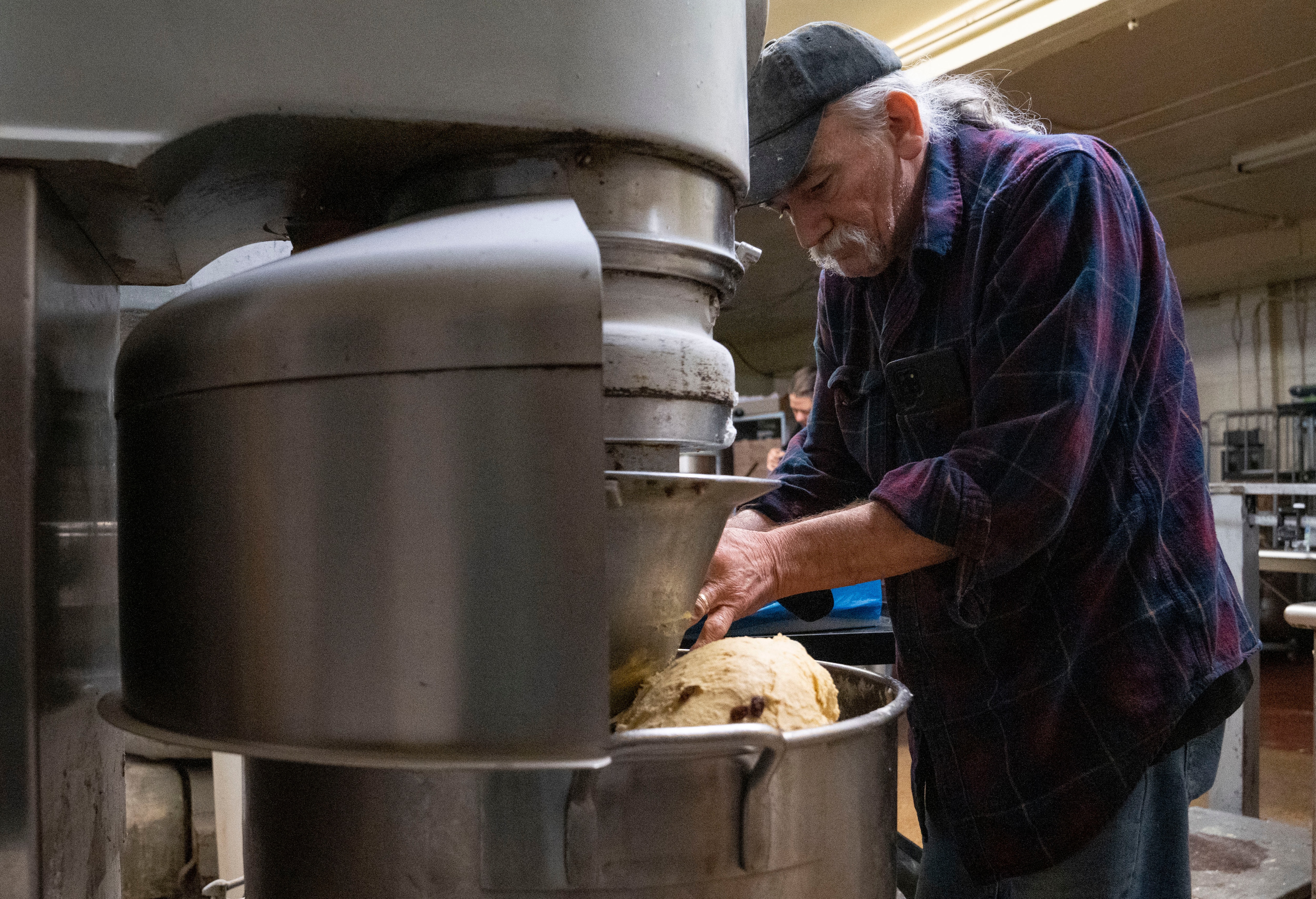 Larry Desantis prepares baked goods inside of Herman's Bakery, in Dundalk on March 28, 2024.
