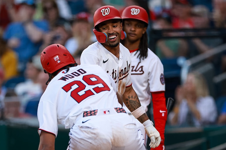 Washington Nationals designated hitter James Wood (29) celebrates with Nasim Nuñez (26) and CJ Abrams (5) after scoring a run against the Kansas City Royals during the third inning.