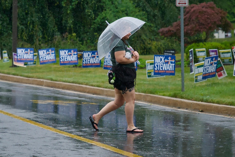 A voter leaves a polling location at Towson University on a rainy Tuesday morning.