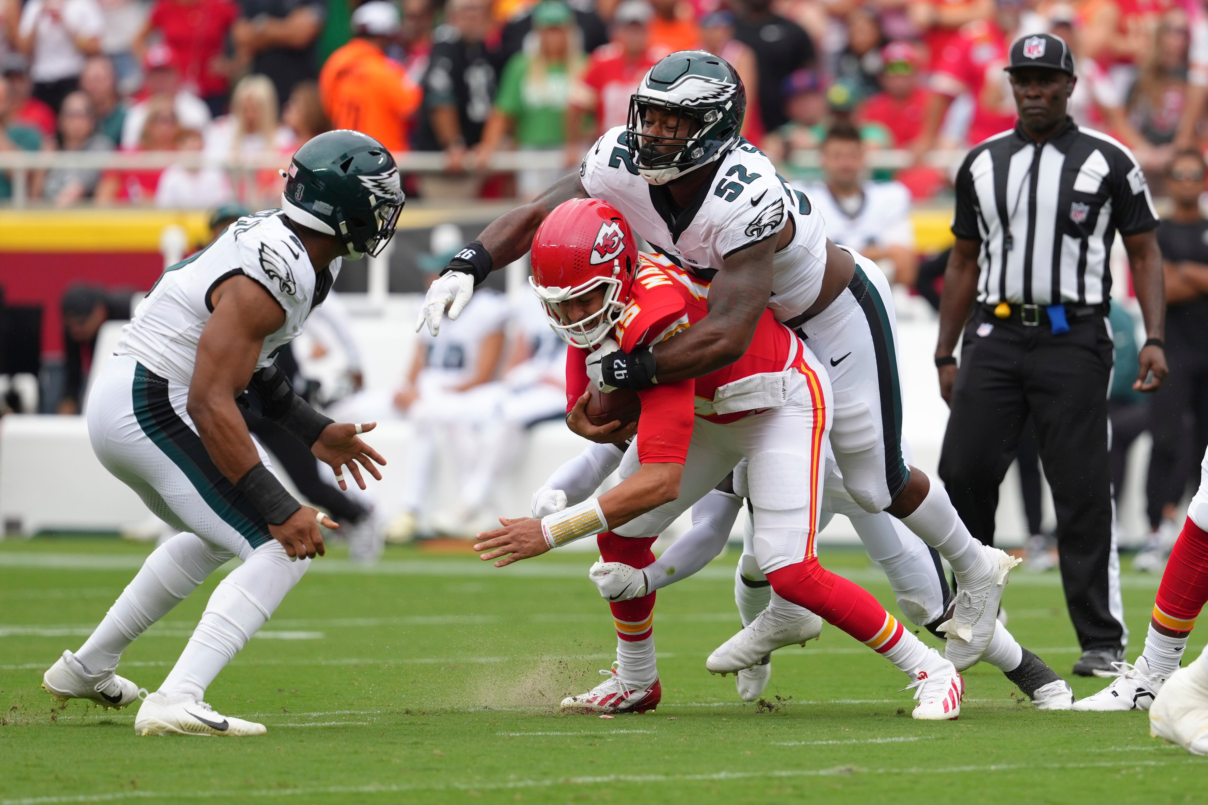 Kansas City Chiefs quarterback Patrick Mahomes (15) is wrapped up by Philadelphia Eagles outside linebacker Za'Darius Smith (52) in Week 2.