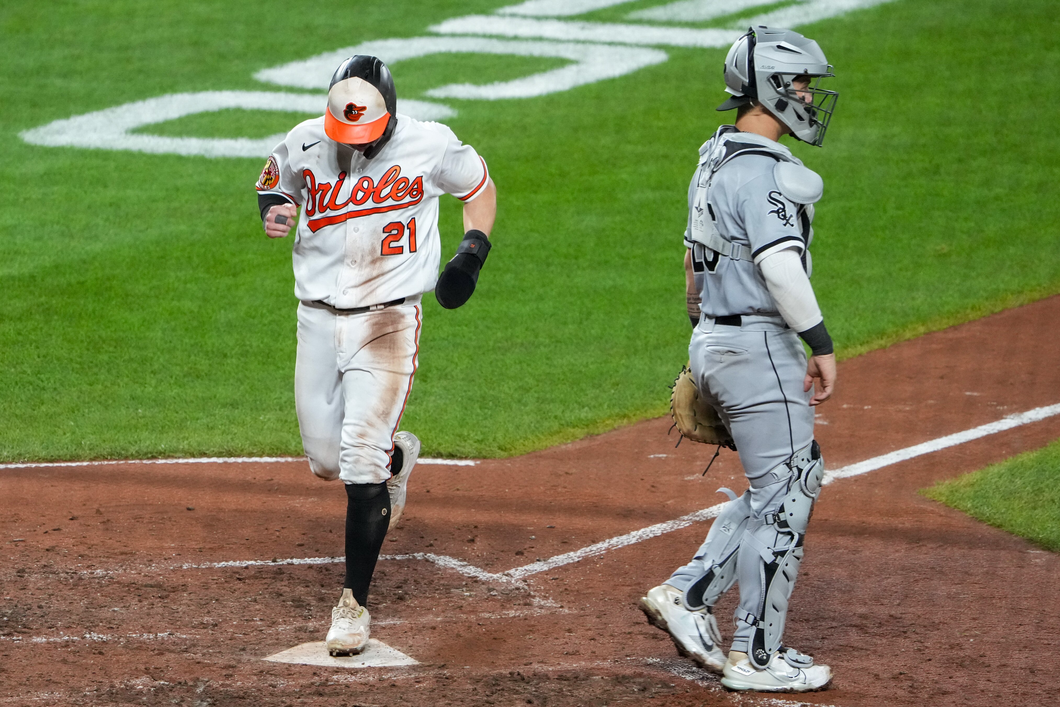 Baltimore Orioles outfielder Austin Hays (21) scores off of his teammate Adam Frazier’s single during a baseball game against the Chicago White Sox at Camden Yards on Tuesday, August 29.