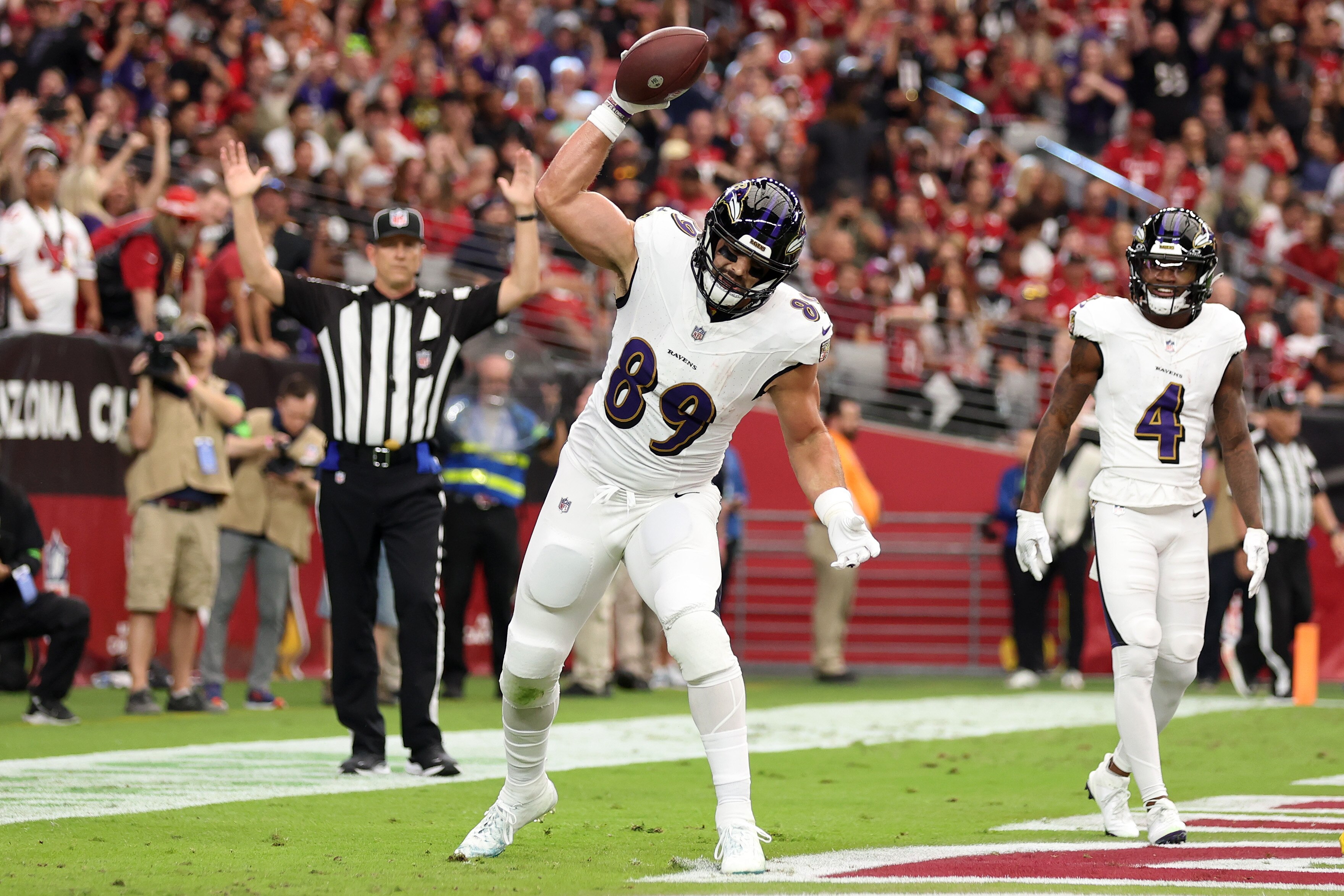 Ravens tight end Mark Andrews spikes the ball after scoring the team's first touchdown in Sunday's 31-24 win over the Arizona Cardinals.