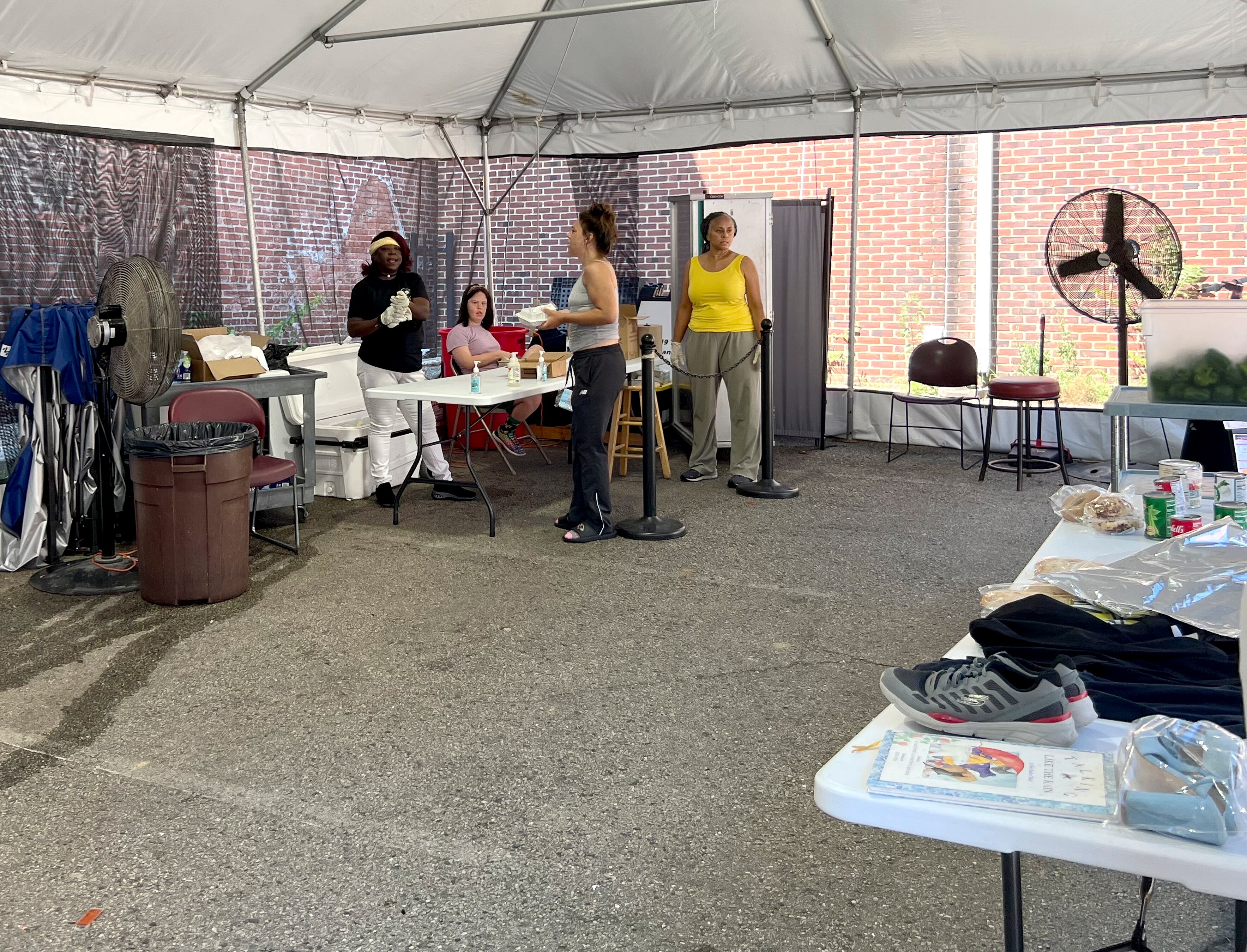 A tent cooled by fans at the Franciscan Center of Baltimore, a community outreach center and soup kitchen between Charles Village and Waverly.