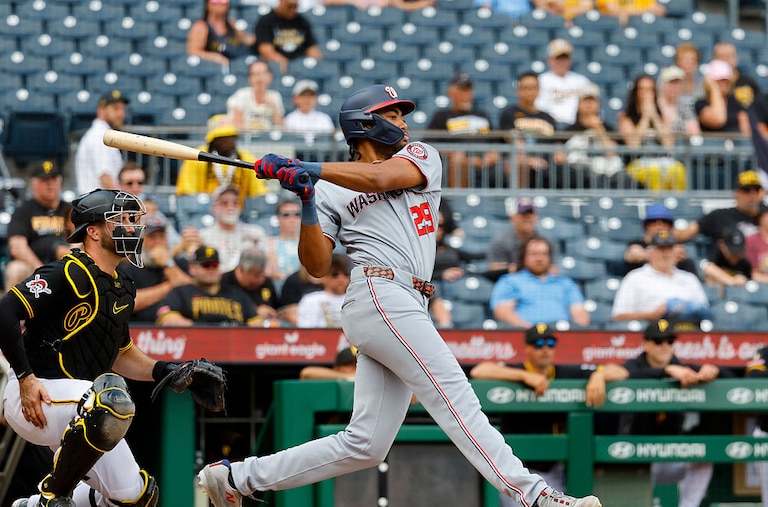 Washington Nationals right fielder James Wood hits an RBI single in the 10th inning.