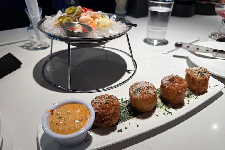 $3 tater tots with the $9 jalapeno pickled shrimp cocktail at STK Steakhouse.