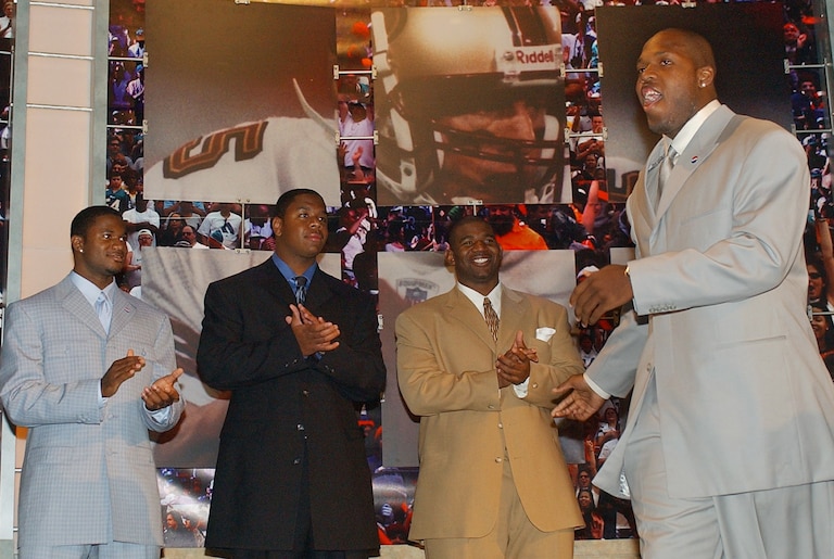 Terrell Suggs, right, a defensive end from Arizona State, is introduced to the crowd prior to the start of the National Football League draft Saturday, April 26, 2003 in New York. From the left are: Terence Newman, a cornerback from Kansas State, quarterback Byron Leftwich from Marshall, and Jimmy Kennedy, a defensive tackle from Penn State.