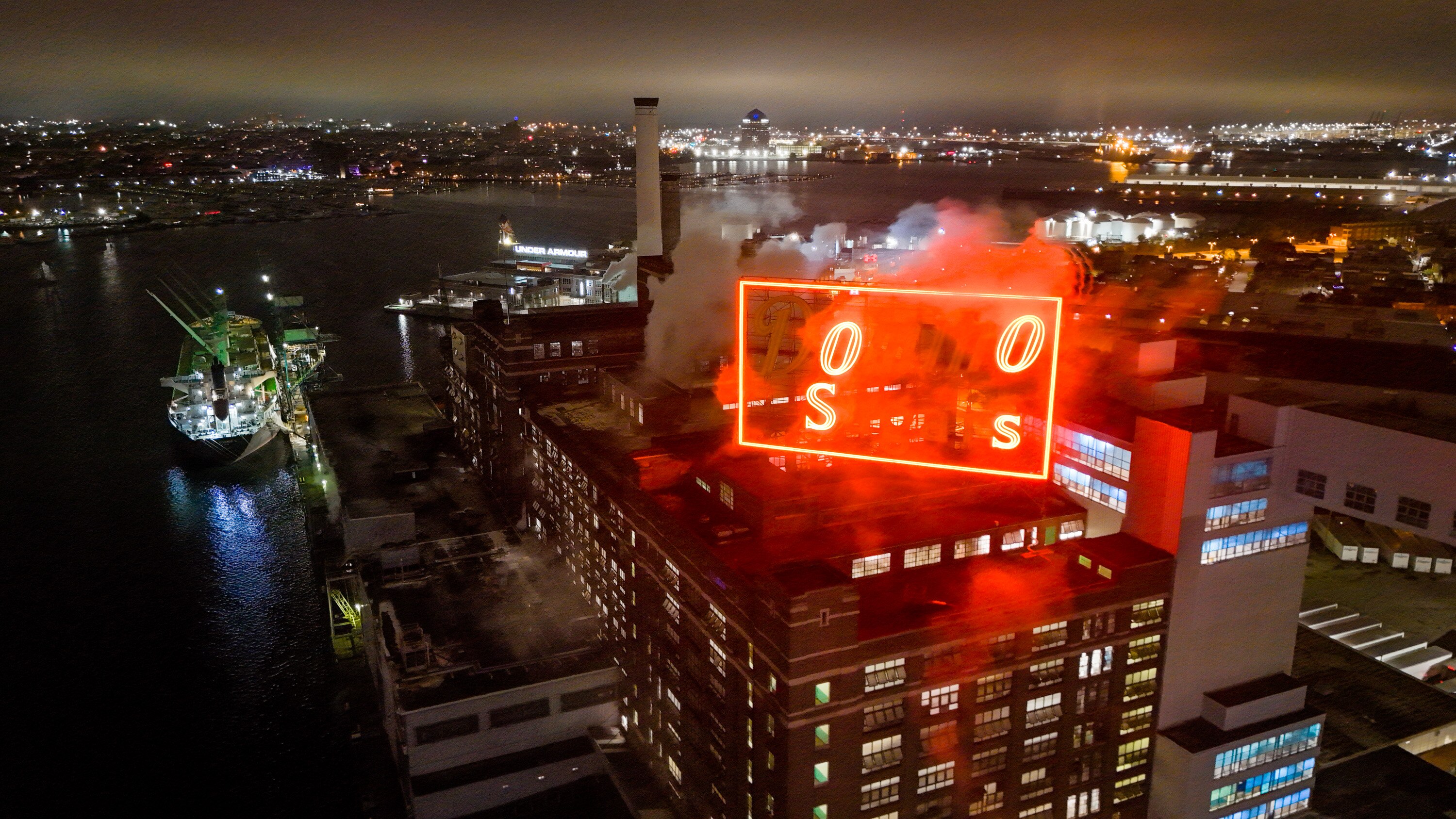 The iconic Domino Sugars sign illuminates only the O’s and S’s to support the Orioles’ playoff run.
