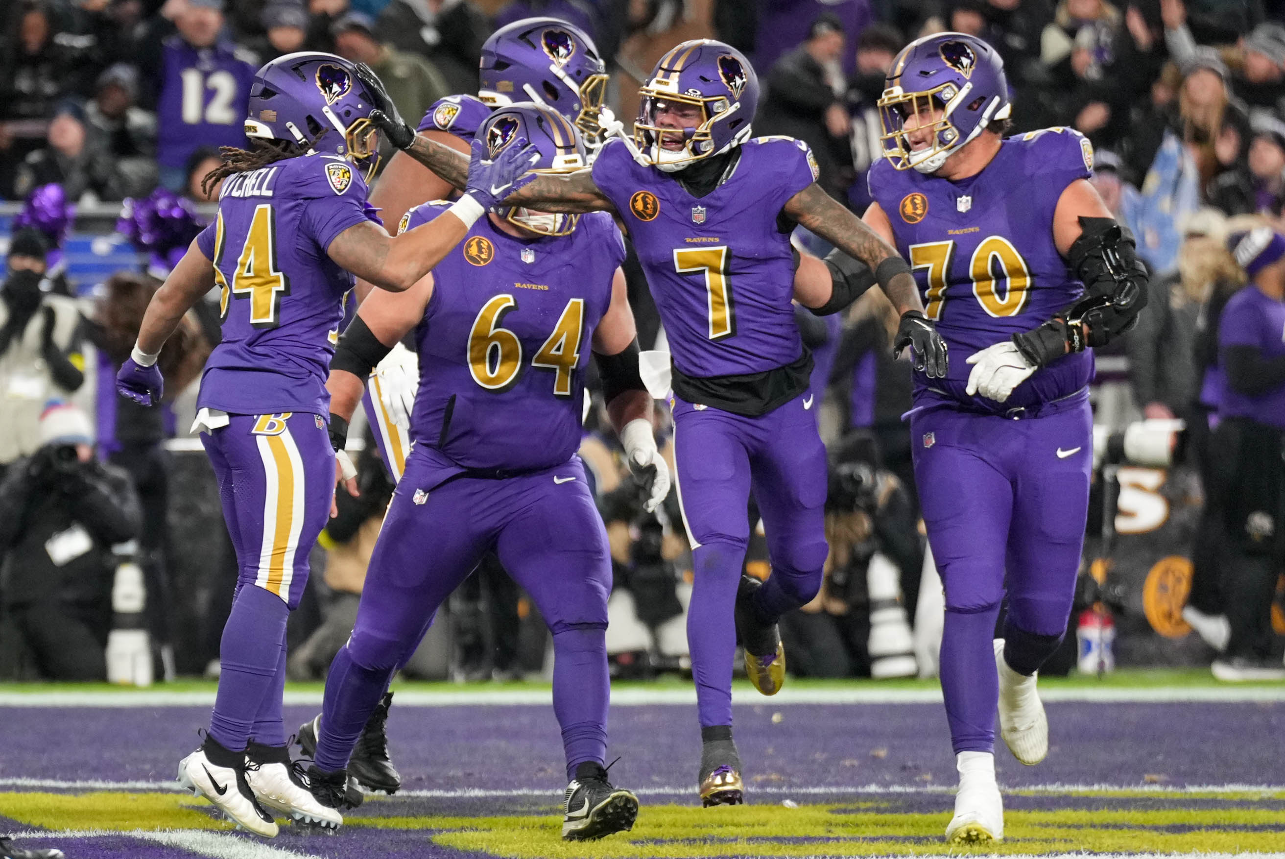 Former Ravens running back Keaton Mitchell (34) celebrates with teammates after rushing for a touchdown against the Bengals last year.