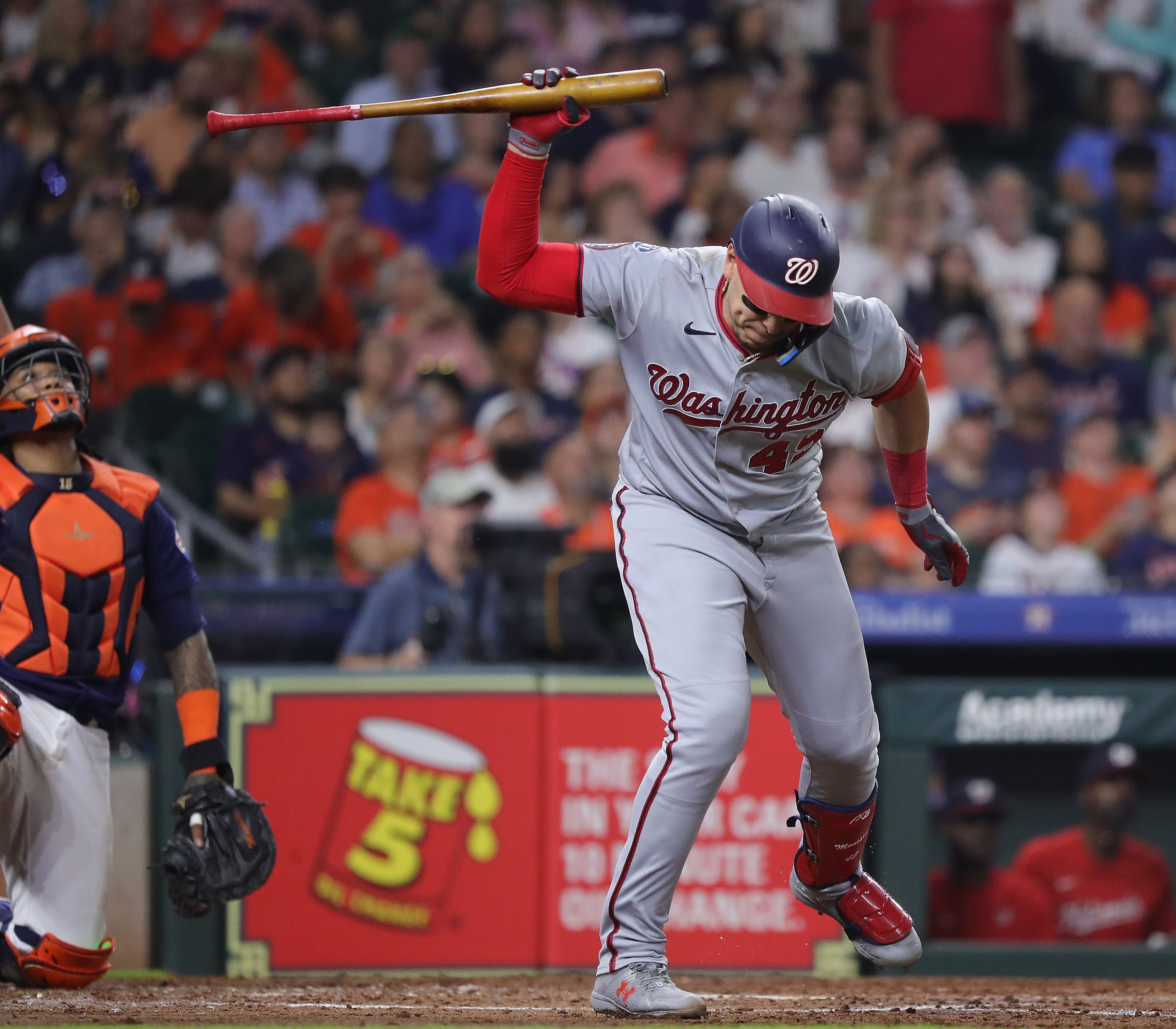 The Nationals’ Joey Meneses slams his bat after hitting a popup in the sixth inning of Washington’s 5-4 loss at Houston.