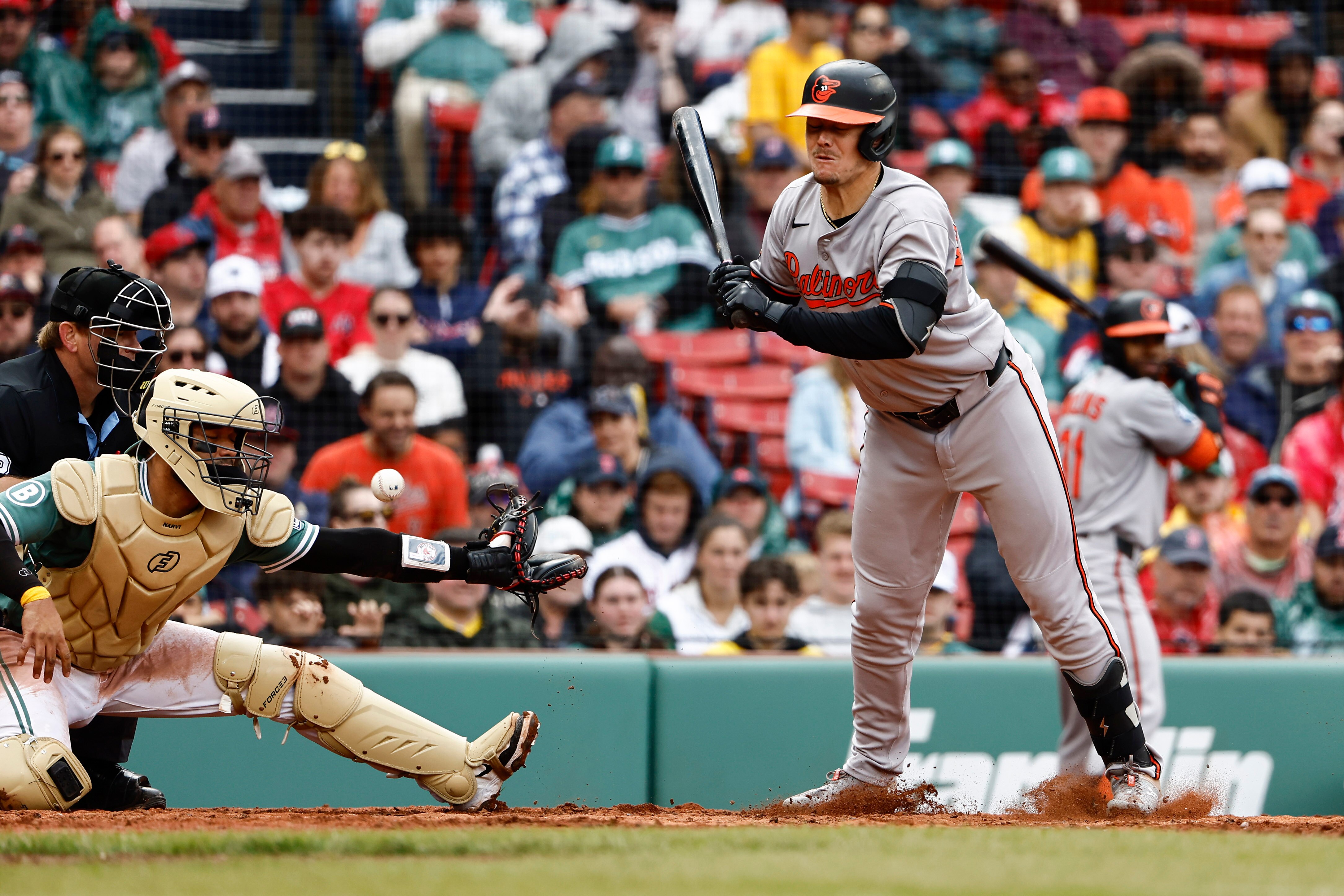 BOSTON, MA - MAY 24: A wild pitch by Sean Newcomb #19 of the Boston Red Sox to Ryan Mountcastle #6 of the Baltimore Orioles gets past catcher Carlos Narváez #75 allowing a run to score during the fifth inning of game one of a doubleheader at Fenway Park on May 24, 2025 in Boston, Massachusetts.