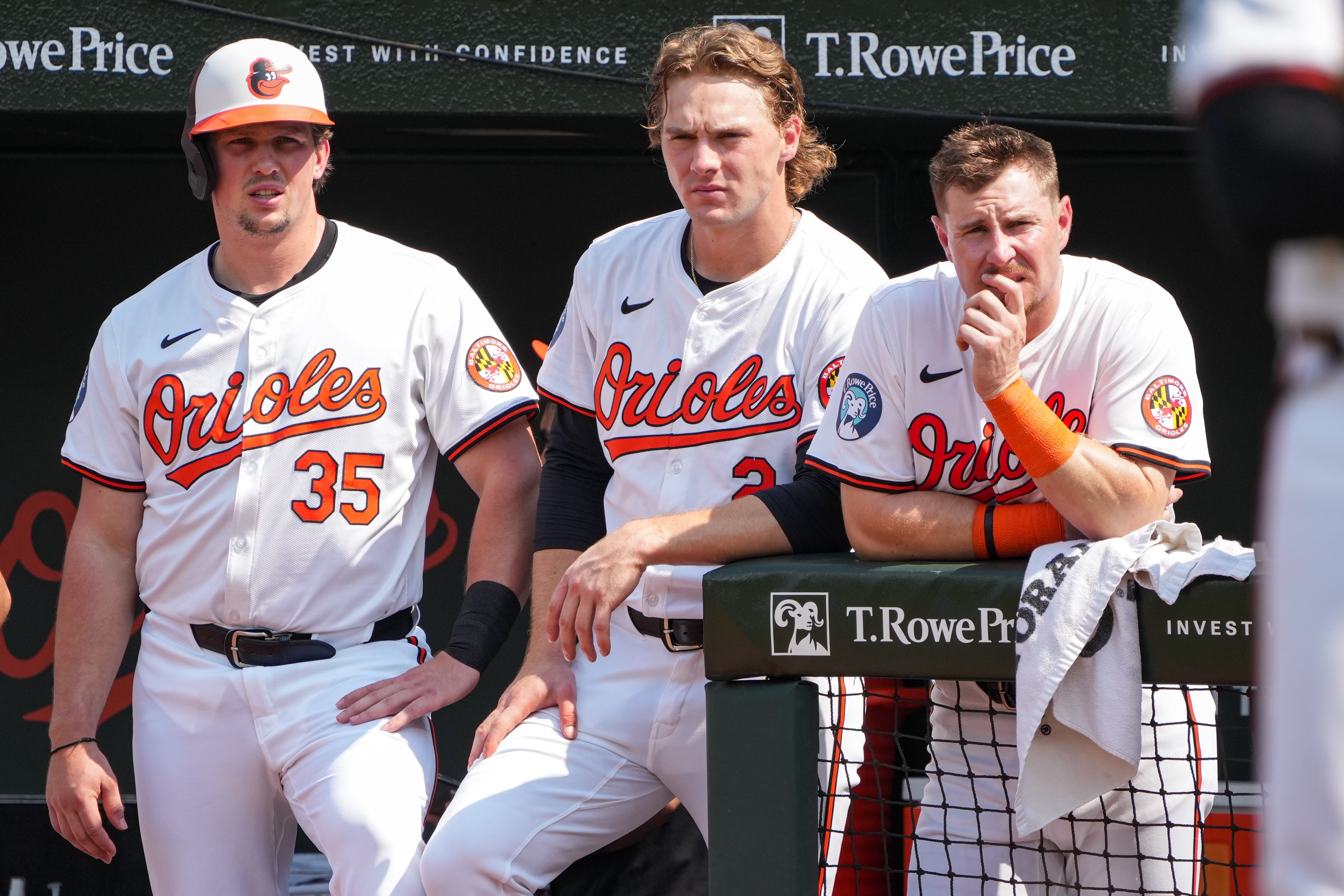 Baltimore Orioles teammates watch from the dugout after catcher James McCann took a pitch to the face during a baseball game against the Toronto Blue Jays at Camden Yards on July 29, 2024.