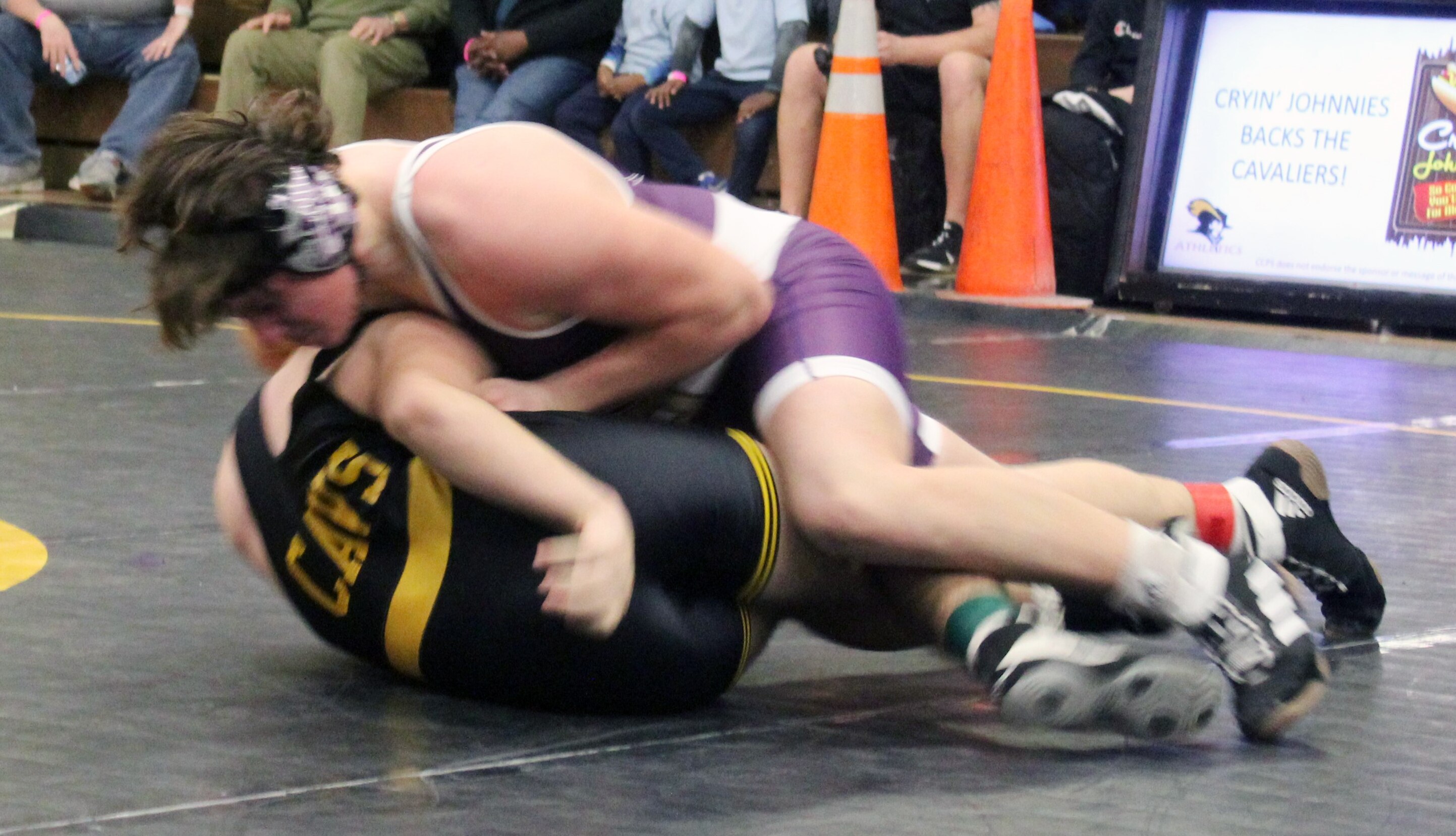 Mount St. Joseph sophomore Brandon Beall (top) won his first-ever varsity match with a fall in 2:47 over South Carroll's Janero Marchany. Beall's 195-pound victory was among four straight by the visiting Gaels, who overcame a 10-point deficit to win, 36-25, on Thursday night.