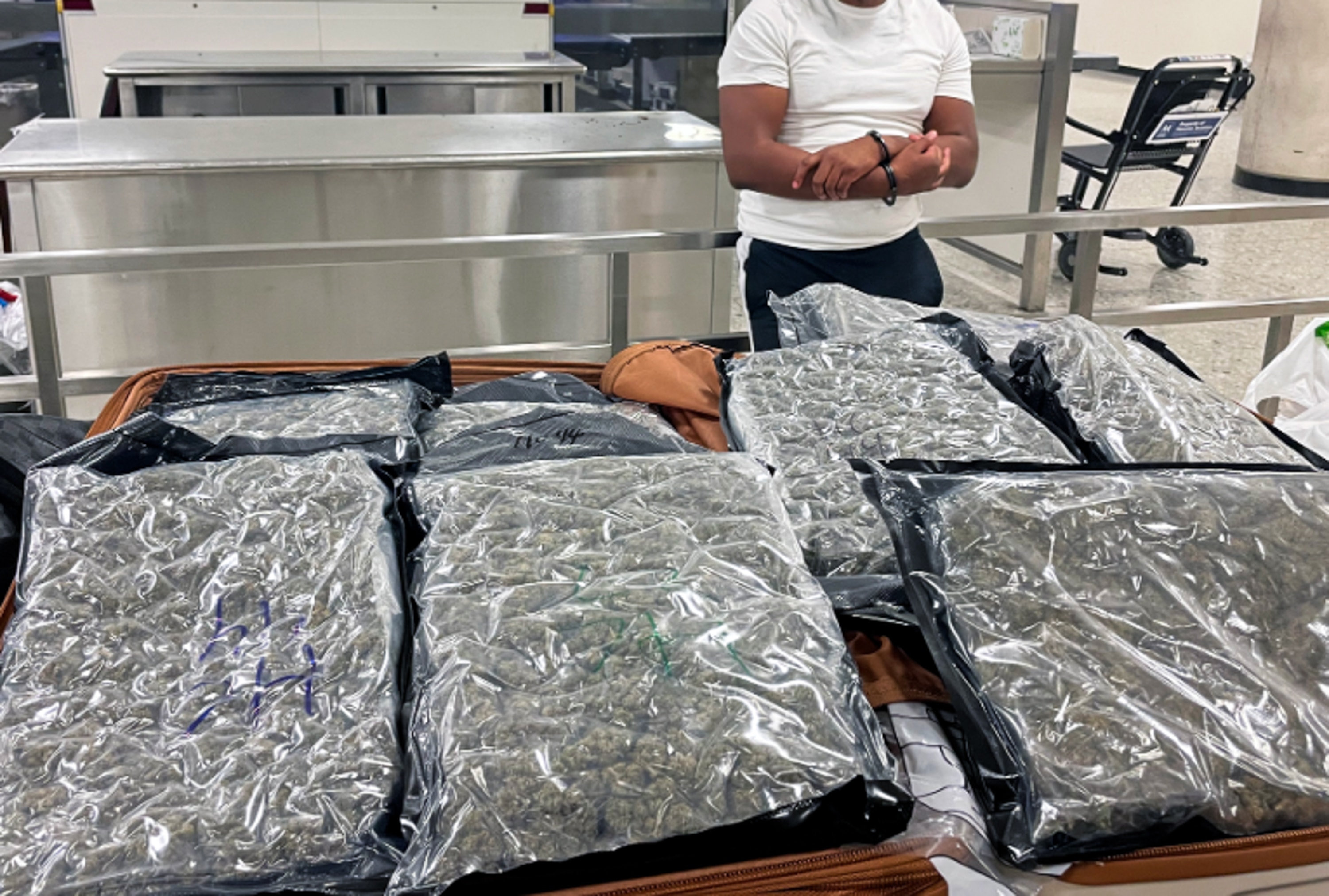 Two Baltimore residents were arrested at Washington Dulles International Airport after U.S. Customs and Border Protection officers on April 16, 2026, intercepted more than 50 pounds of marijuana in checked luggage bound for a London flight.