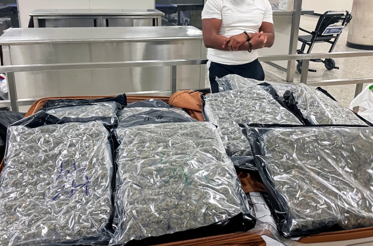 Two Baltimore residents were arrested at Washington Dulles International Airport after U.S. Customs and Border Protection officers on April 16, 2026, intercepted more than 50 pounds of marijuana in checked luggage bound for a London flight.