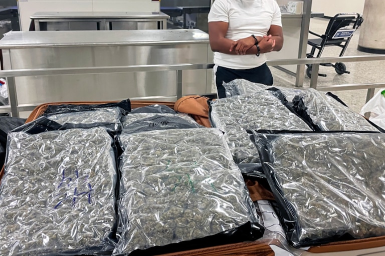 Two Baltimore residents were arrested at Washington Dulles International Airport after U.S. Customs and Border Protection officers on April 16, 2026, intercepted more than 50 pounds of marijuana in checked luggage bound for a London flight.