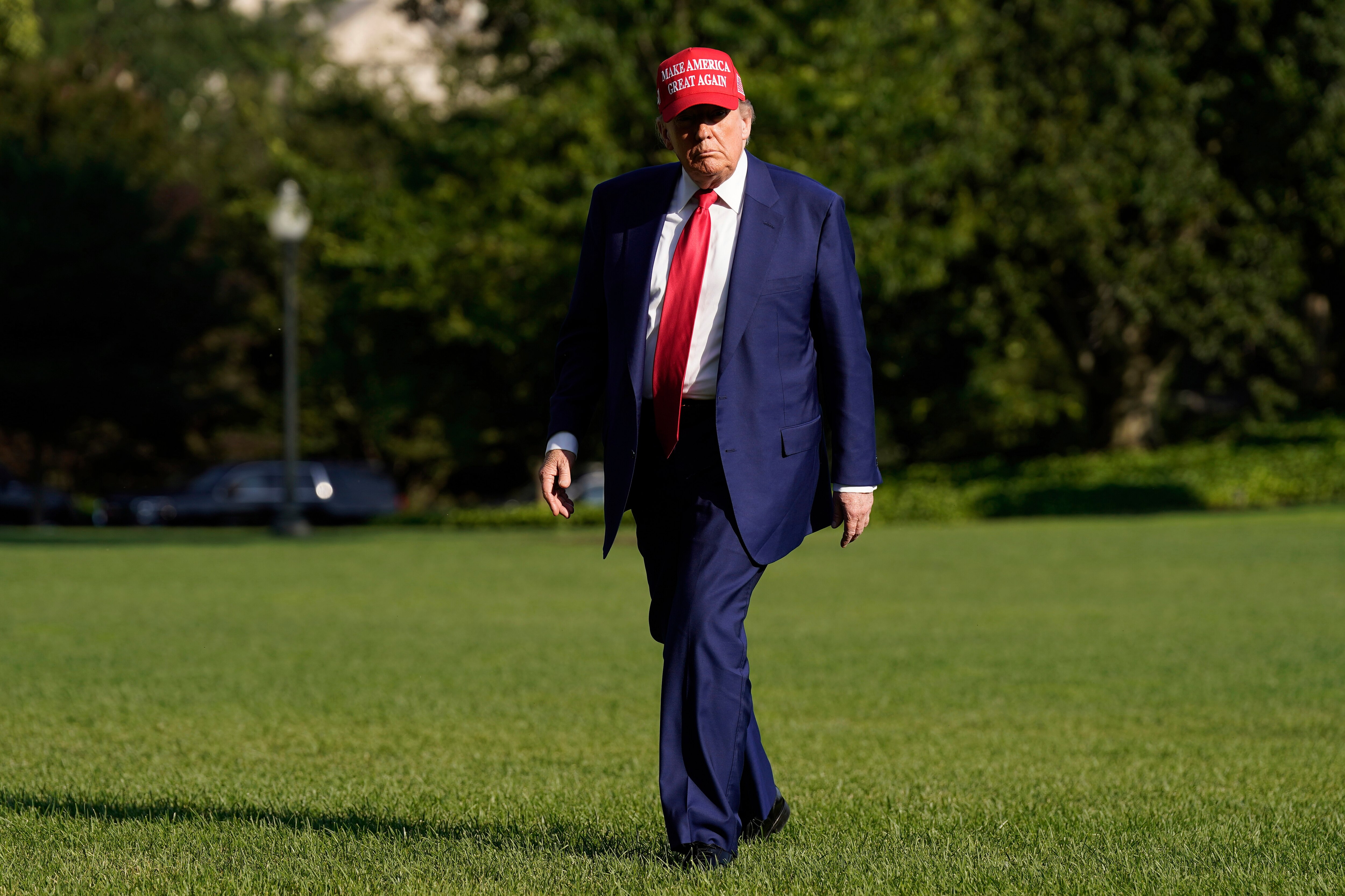 President Donald Trump walks on the South Lawn upon arriving at the White House, Saturday, June 21, 2025, in Washington.