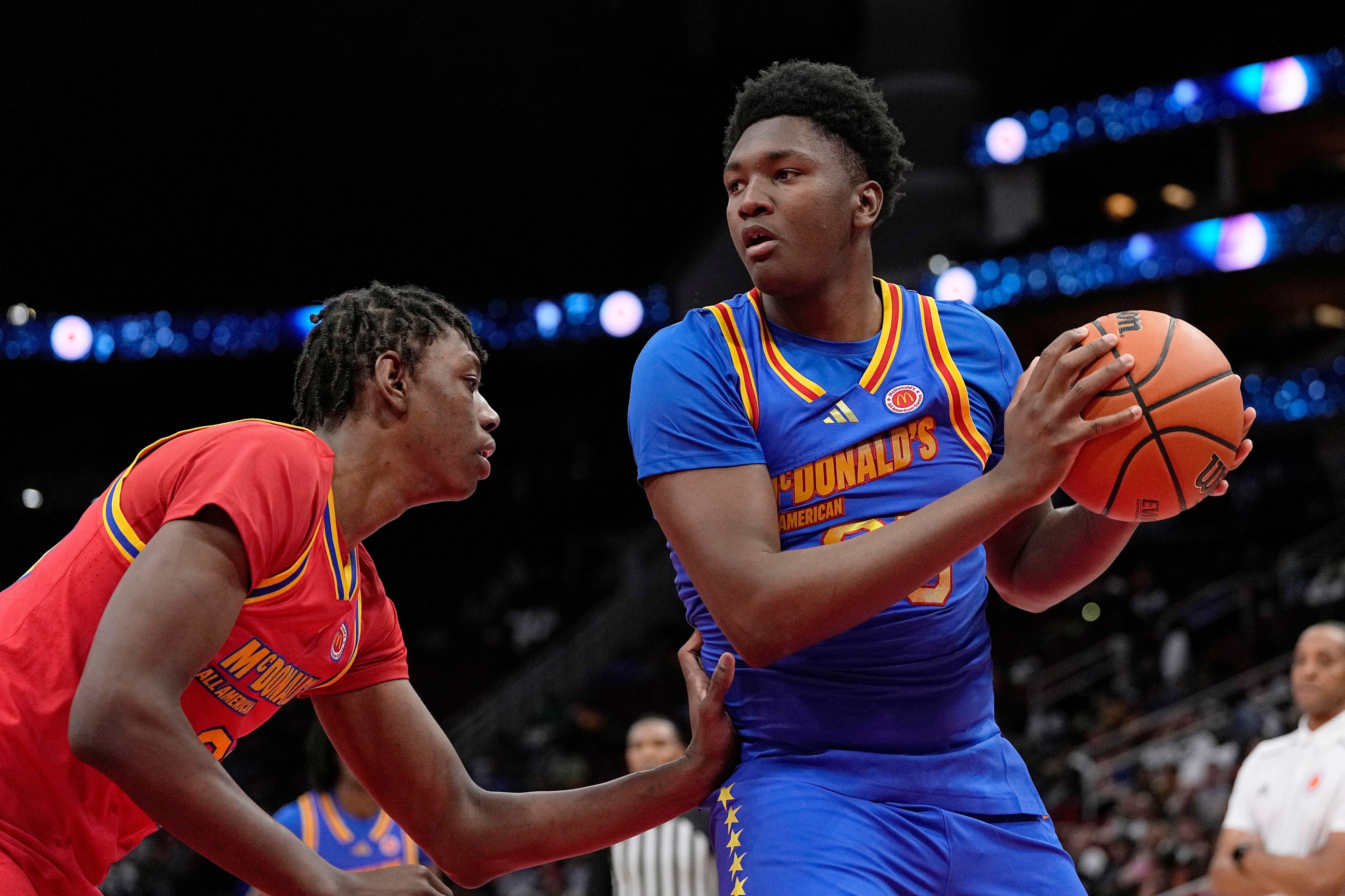 East center Derik Queen (25) is defended by West center Aiden Sherrell, left, during the third quarter of the McDonald's All-American boys' basketball game Tuesday, April 2, 2024, in Houston.