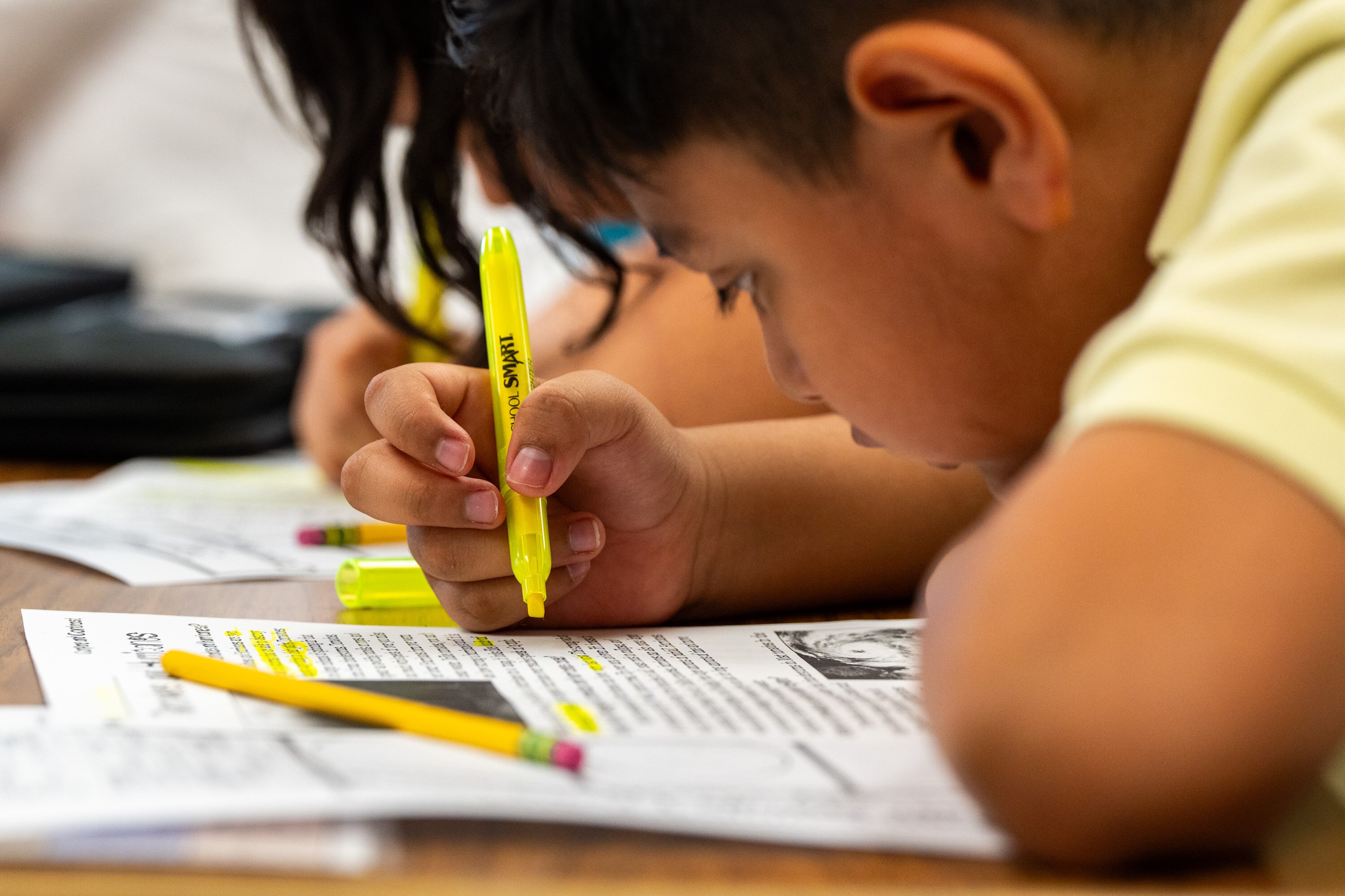 A student highlights a reading passage at Lamont Elementary School in New Carrollton.