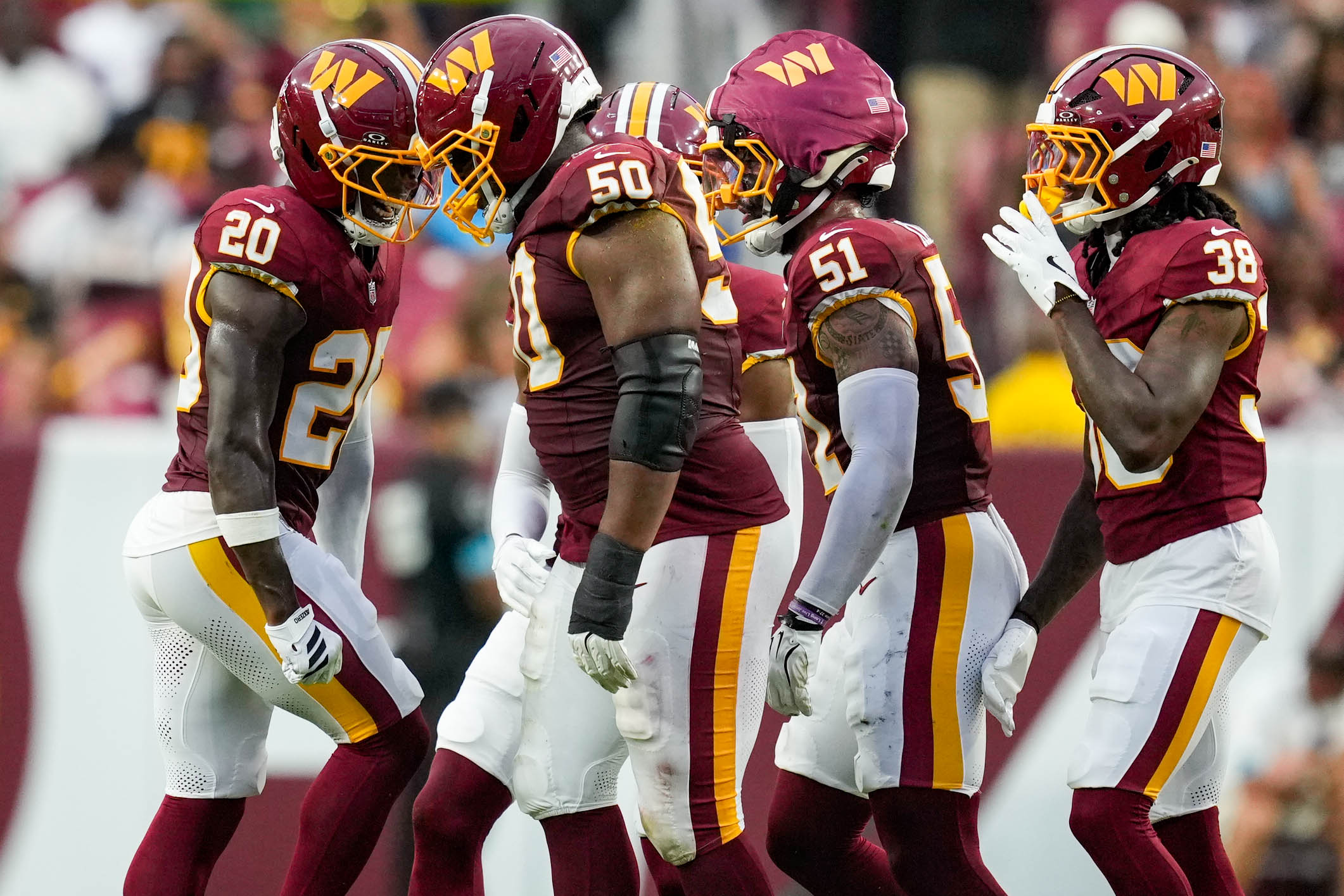 Washington Commanders defensive tackle Ricky Barber (50) celebrates a fourth down stop in the first quarter of a preseason game against the Miami Dolphins on Aug. 14.