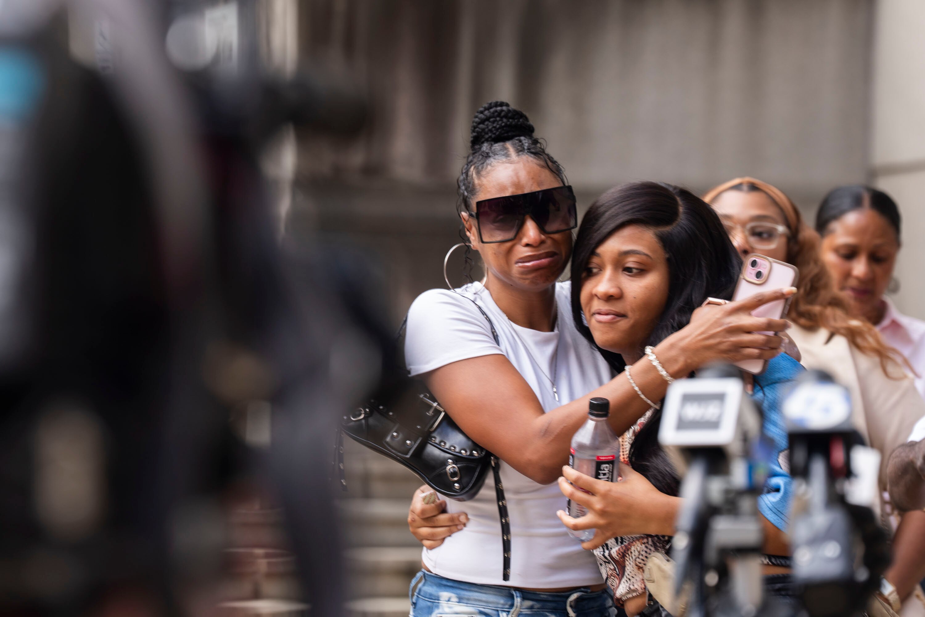 Family and loved ones of Dontae Melton Jr. console each other at a September news conference. Melton’s attorney said Wednesday that Baltimore Police officers will not face charges in Melton’s June death.