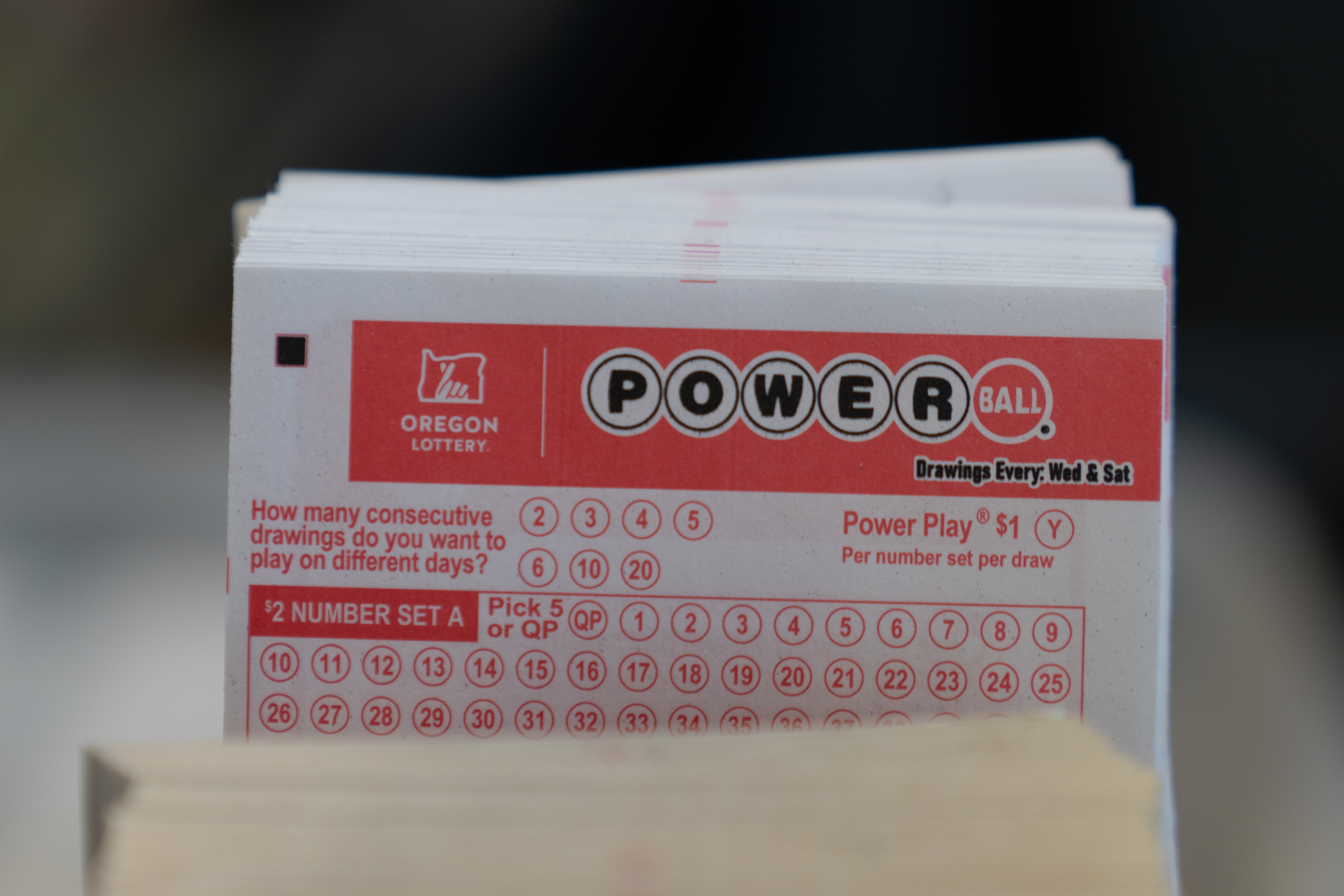 Powerball lottery tickets are displayed for customers to fill out at a convenience store on Monday, Dec. 22, 2025, in Portland, Ore.