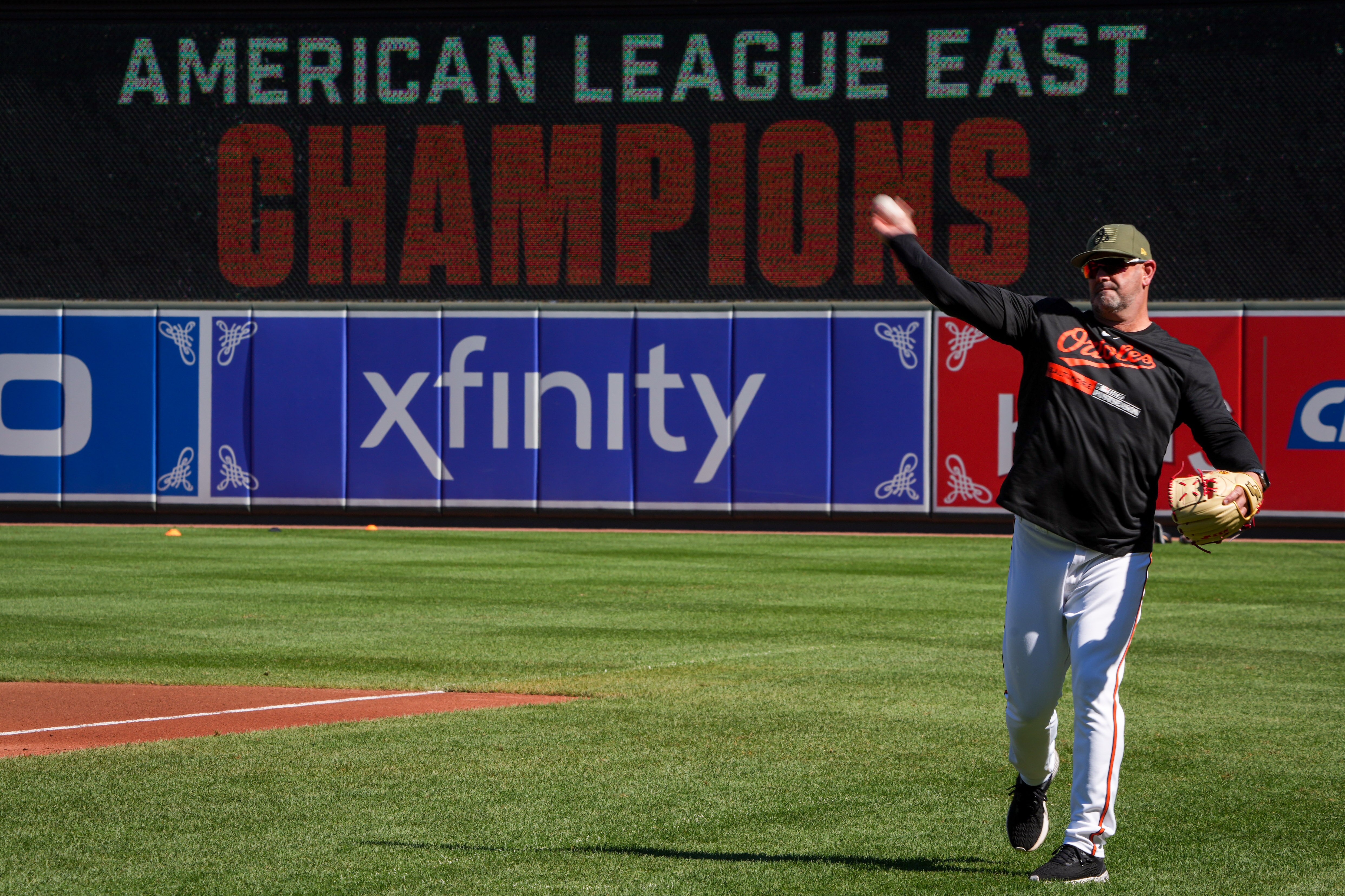 Orioles manager Brandon Hyde throws to a player during an open practice at Camden Yards on Wednesday as the team prepared for the American League Division Series.