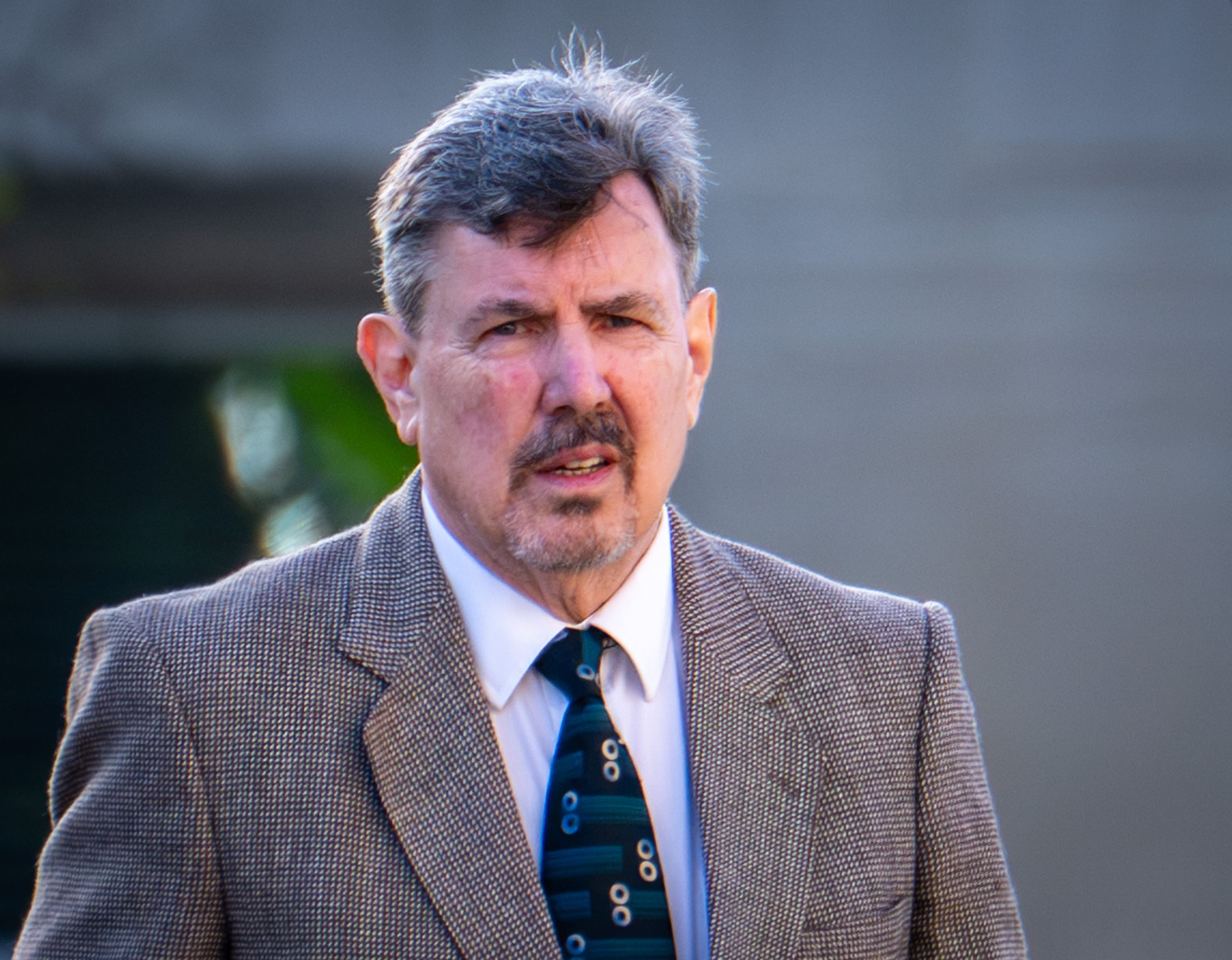 Former Catholic priest Bill Mannion arrives at the Baltimore County Courthouse on Monday for jury selection in his criminal trial. He was indicted last year on 15 felony sex and child abuse charges. 
