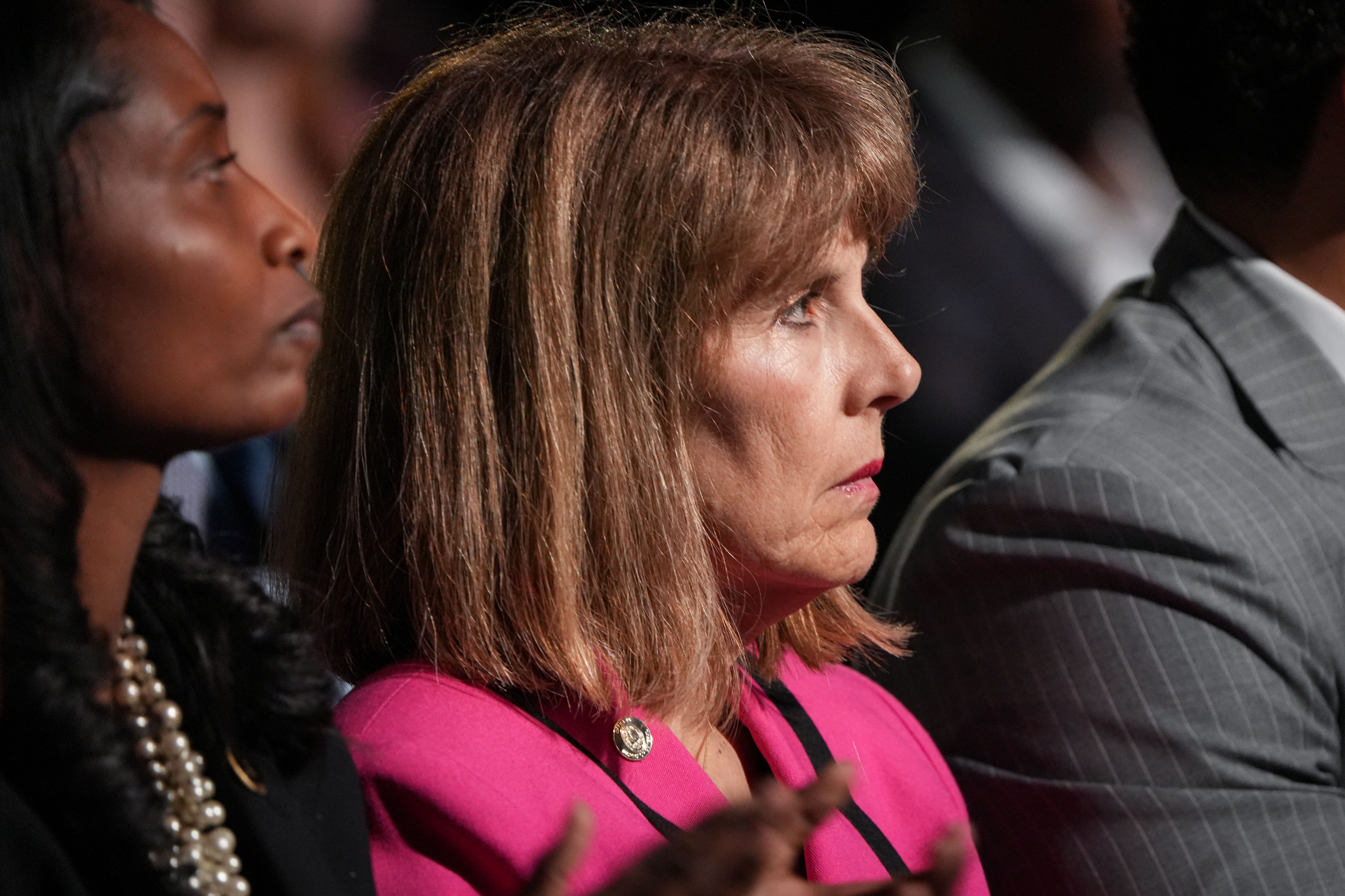 Baltimore City Inspector General Isabel Cumming listens as Mayor Brandon Scott gives the annual State of the City address on Monday, April 17. The event was held at the Middle Branch Fitness and Wellness Center in South Baltimore.
