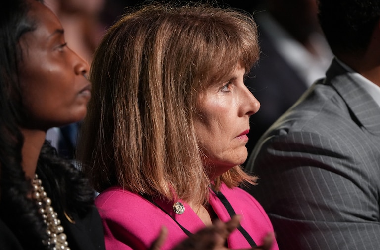 Baltimore City Inspector General Isabel Cumming listens as Mayor Brandon Scott gives the annual State of the City address on Monday, April 17. The event was held at the Middle Branch Fitness and Wellness Center in South Baltimore.