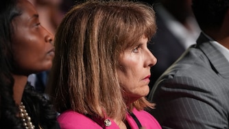 Baltimore City Inspector General Isabel Cumming listens as Mayor Brandon Scott gives the annual State of the City address on Monday, April 17. The event was held at the Middle Branch Fitness and Wellness Center in South Baltimore.