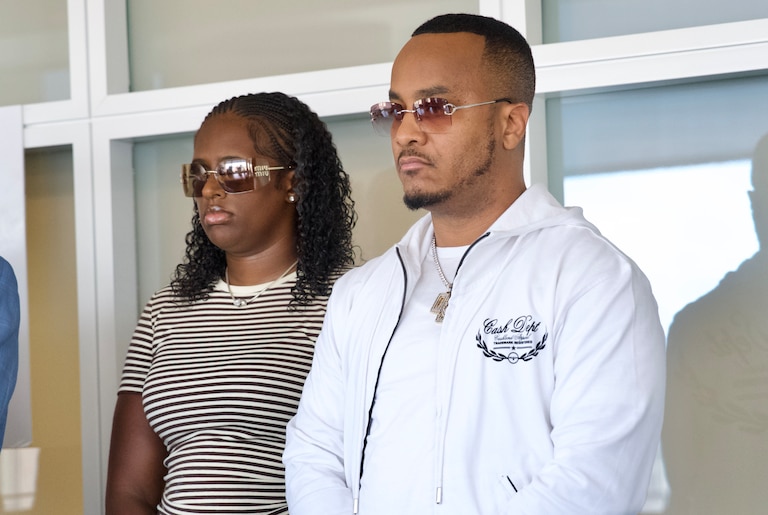 August 25, 2026 - DJ Quicksilva, friend of Big Sam, next to Kayla Brown, attends a press conference in honor of Samuel "Big Sam" Elseworth Brown Jr. Baltimore County Police Officer Derek Hadel punched Samuel “Big Sam” Elsworth Brown Jr. during a February wellness check that led to Brown’s death. Hadel will not be charged for his role in Brown’s death.