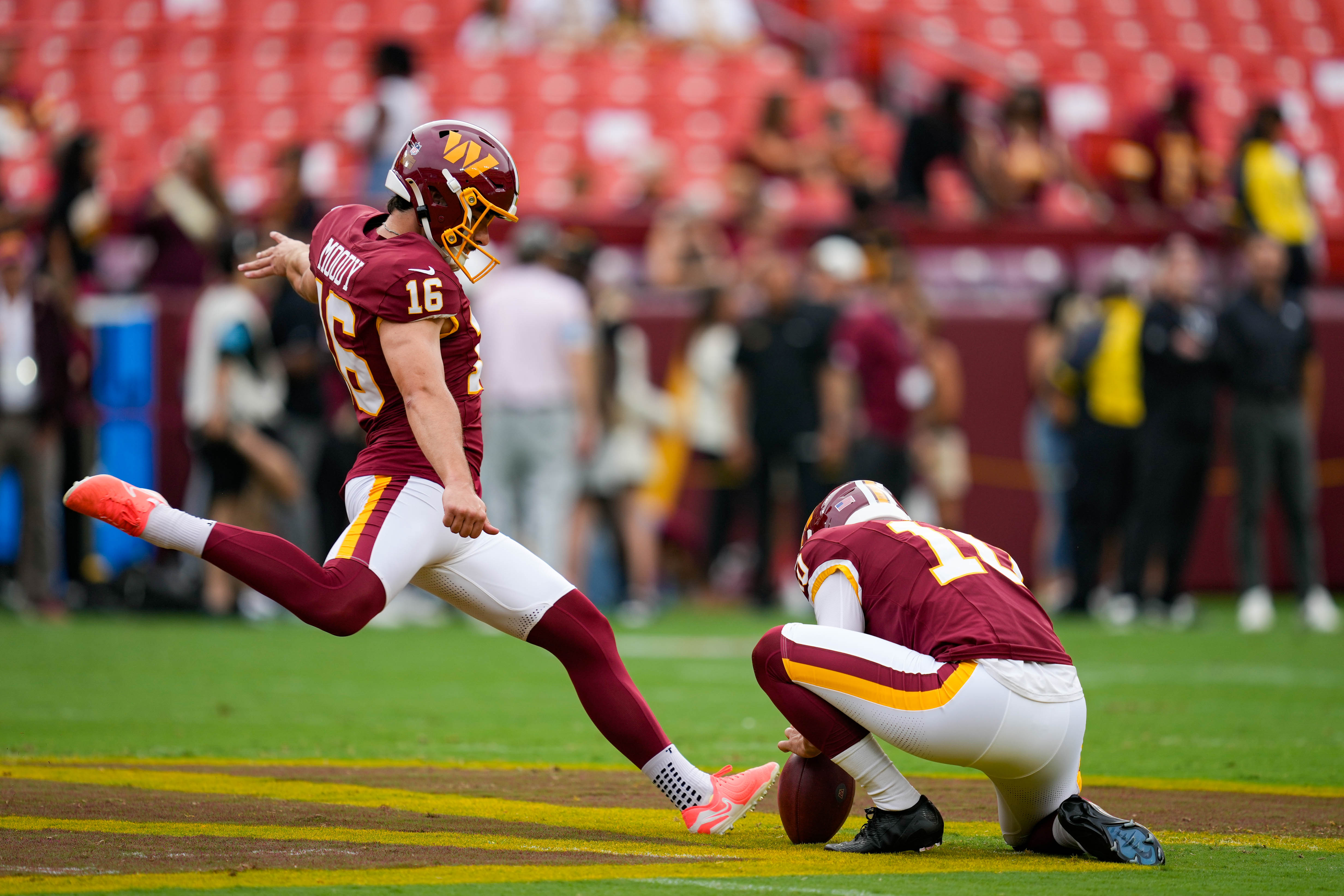 Place kicker Jake Moody (16) kicks a field goal ahead of the Washington Commanders’ preseason game against the Miami Dolphins on Aug. 14.
