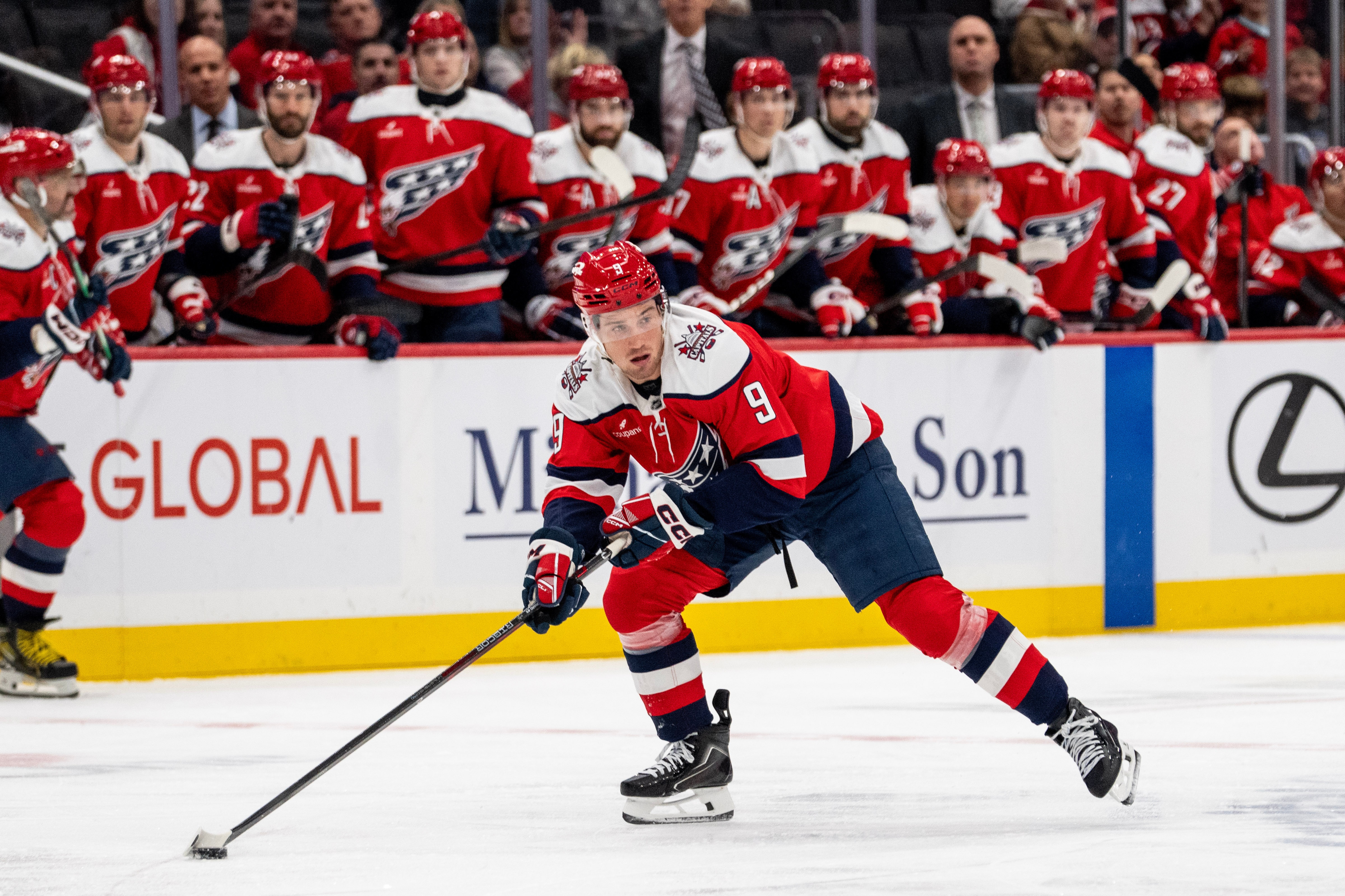 Washington Capitals right wing Ryan Leonard (9) skates with the puck during the first period of an NHL hockey game against New Jersey Devils, Saturday, Oct. 17, 2026, in Washington. (AP Photo/Nathan Howard)