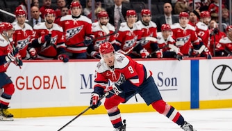 Washington Capitals right wing Ryan Leonard (9) skates with the puck during the first period of an NHL hockey game against New Jersey Devils, Saturday, Oct. 17, 2026, in Washington. (AP Photo/Nathan Howard)