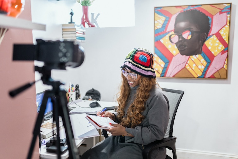 BALTIMORE, MD - JAN 15, 2025: Kendall McGill, 31, works on creating content for Youtube in her home in Baltimore on January 15, 2025. She reports that she has slowed down on creating content for Tiktok as the possible ban approaches.