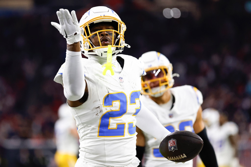 HOUSTON, TEXAS - JANUARY 11: Tony Jefferson #23 of the Los Angeles Chargers celebrates a fumble recovery against the Houston Texans in the third quarter during the AFC Wild Card Playoffs at NRG Stadium on January 11, 2025 in Houston, Texas.