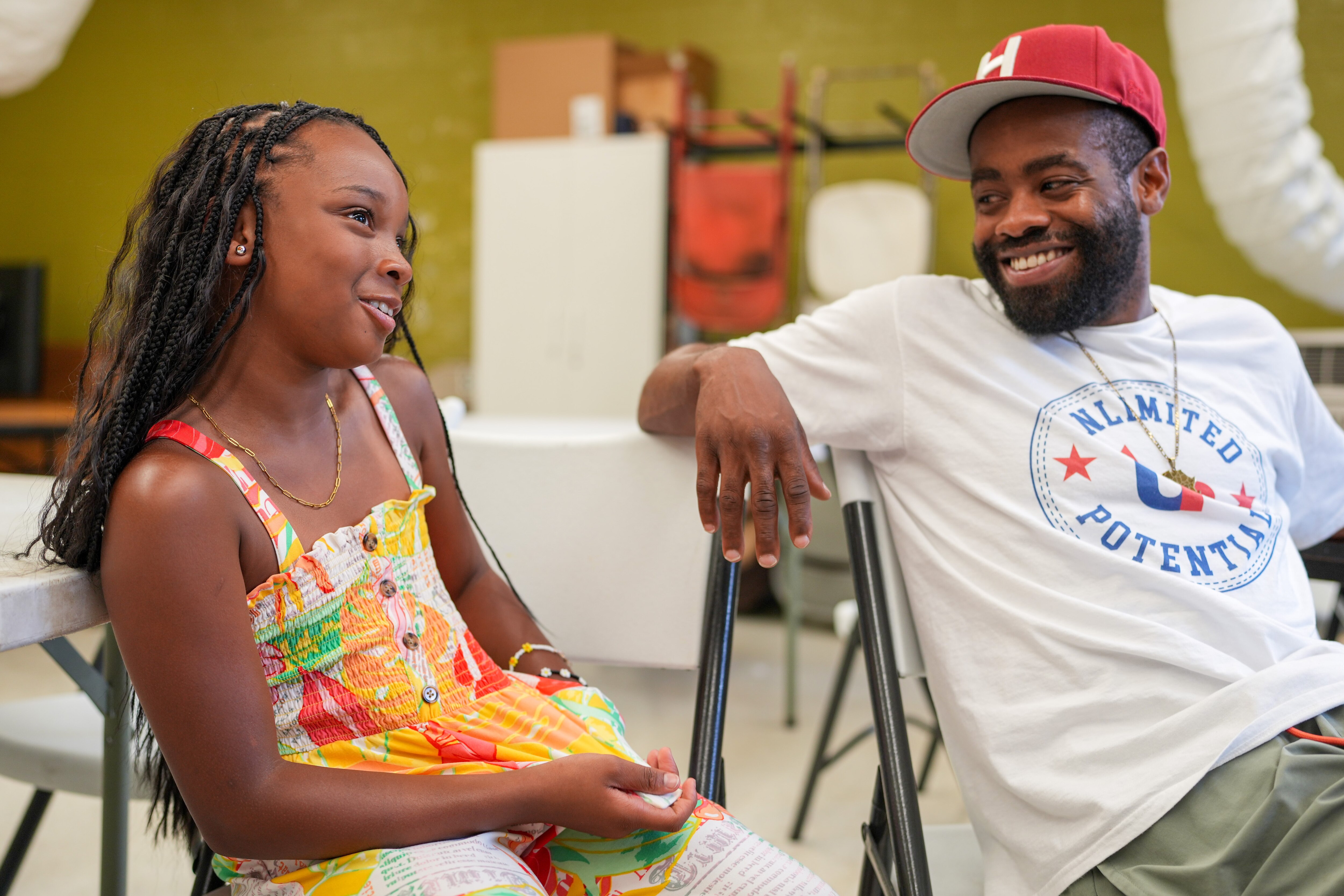 Haneef Hardy, founder of the Unlimited Potential nonprofit, is photographed next to his 9-year-old niece, Sky Jones, during an interview with The Baltimore Banner at the Robert C. Marshall Recreation Center on July 3, 2023.
