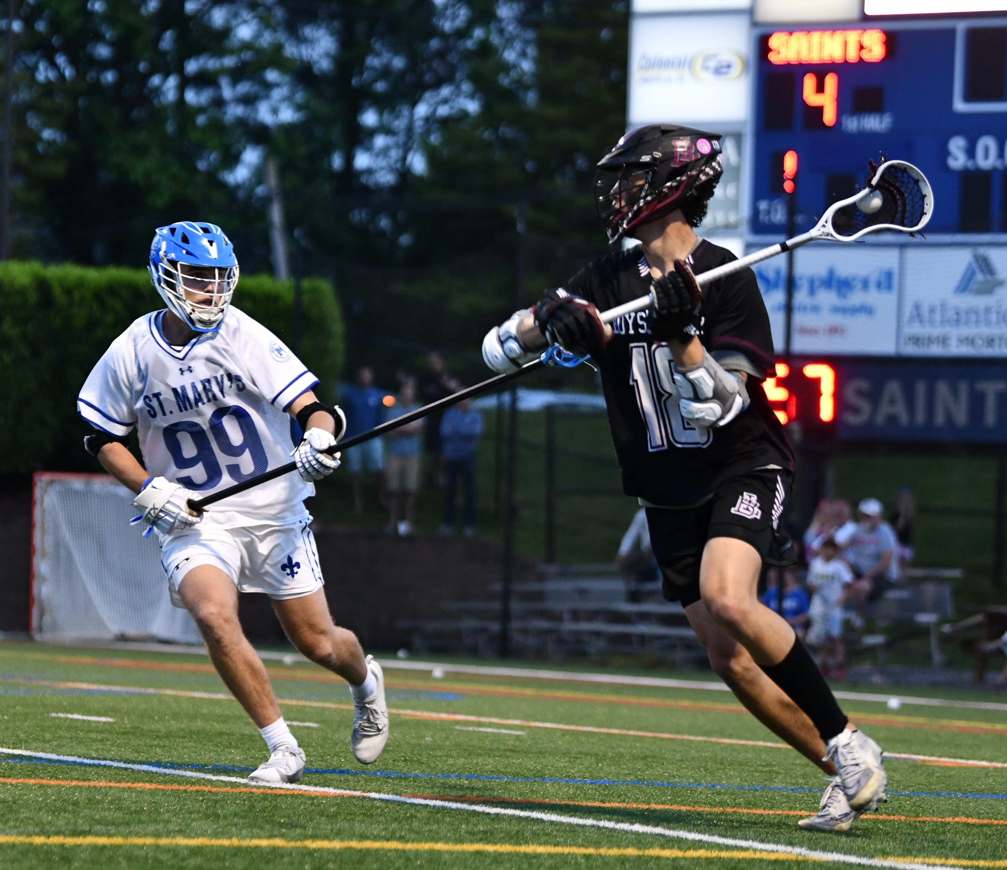 Boys' Latin's Spencer Ford (right) is defended by St. Mary's longstick Dillon Torggler during Friday's MIAA A Conference lacrosse quarterfinal match.