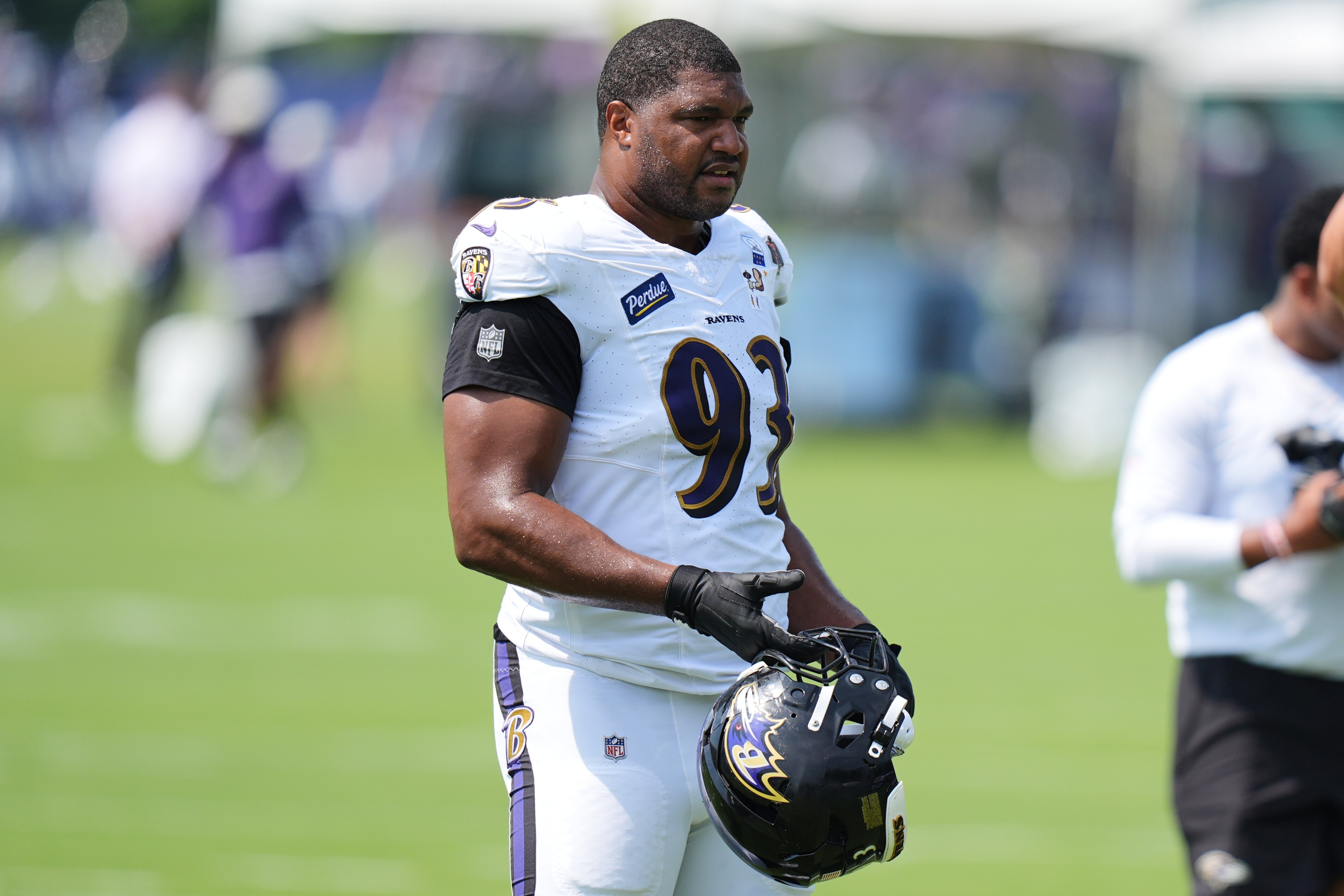 Baltimore Ravens defensive end Calais Campbell (93) watches during the team's NFL football training camp, Tuesday, Aug. 11, 2026, at the Under Armour Performance Center in Owings Mills, Md.
