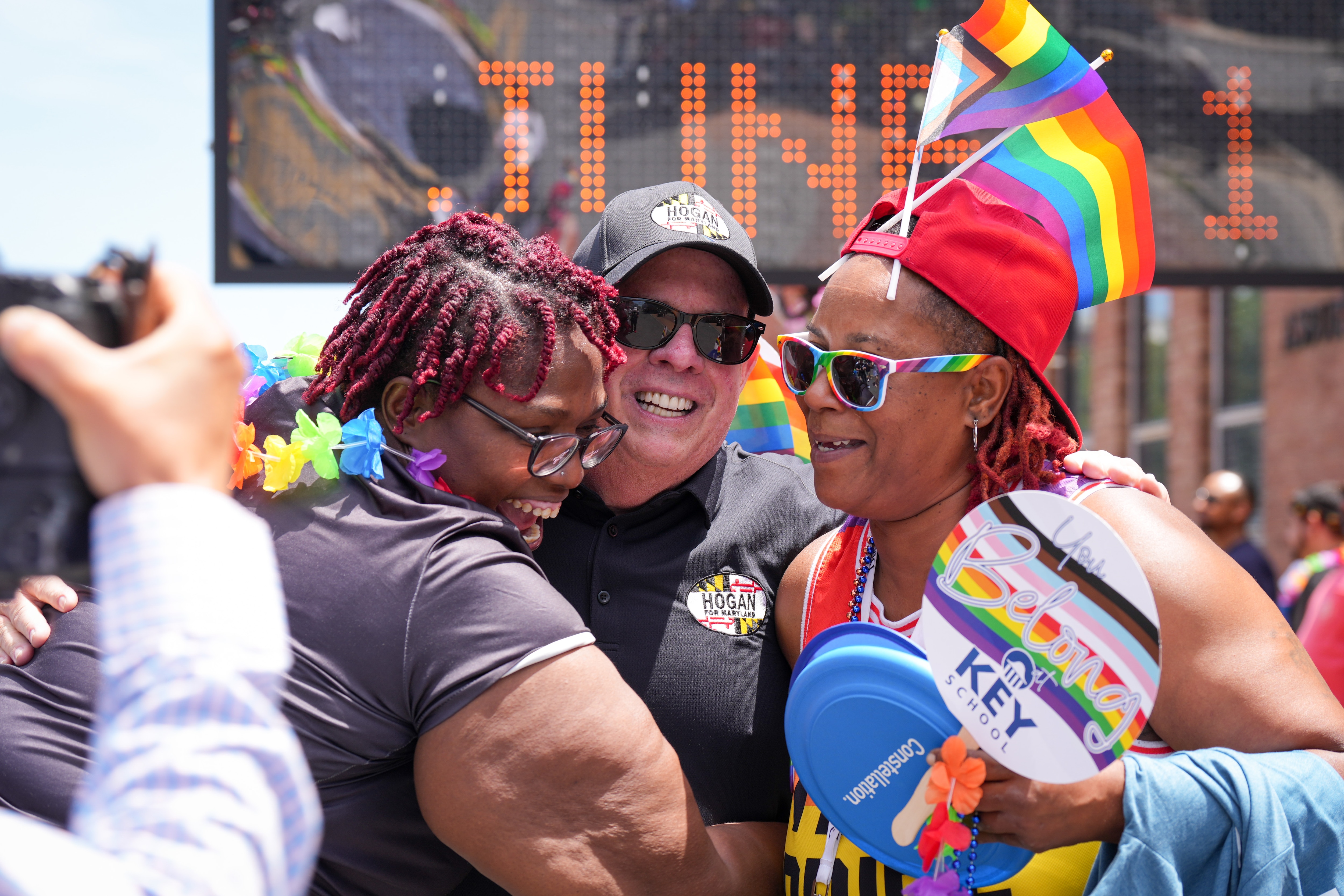 Larry Hogan (middle), U.S. Senate candidate and former governor of Maryland, hugs supporters as he marches in the Annapolis Pride Parade and Festival on June 1, 2024.