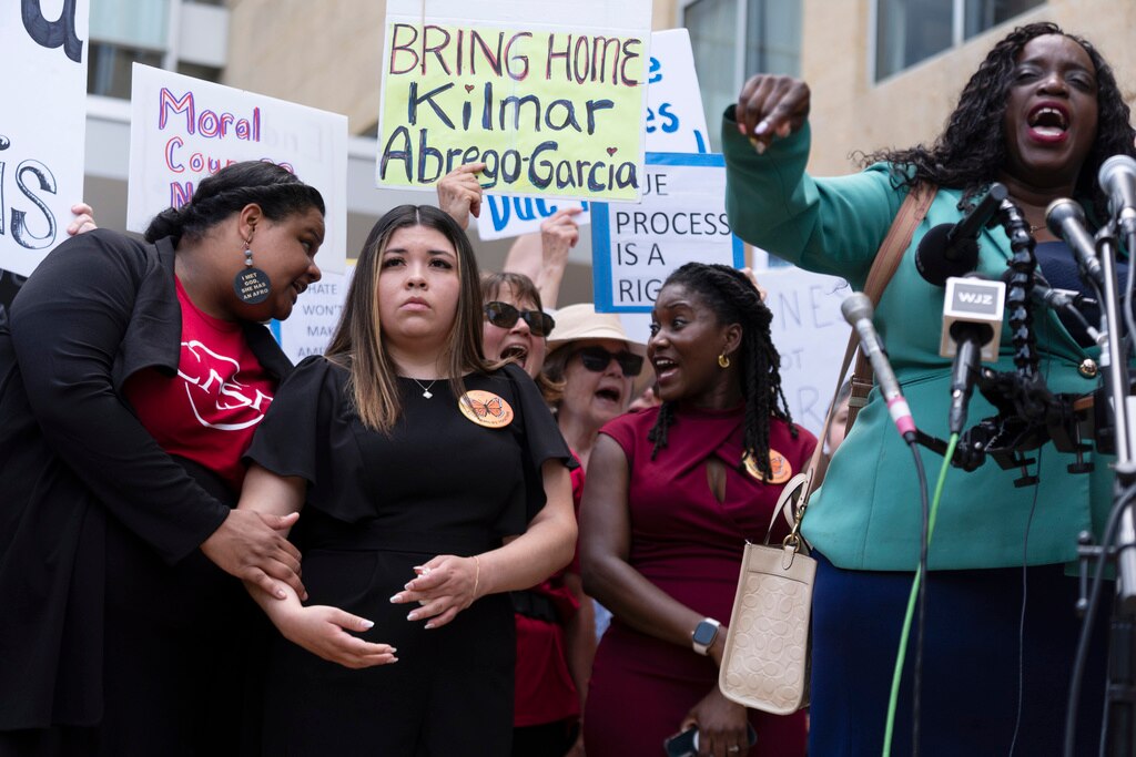 Wife of Kilmar Abrego Garcia, Jennifer Vasquez Sura, second from left, joins a rally outside the U.S. Courthouse in Greenbelt, Md